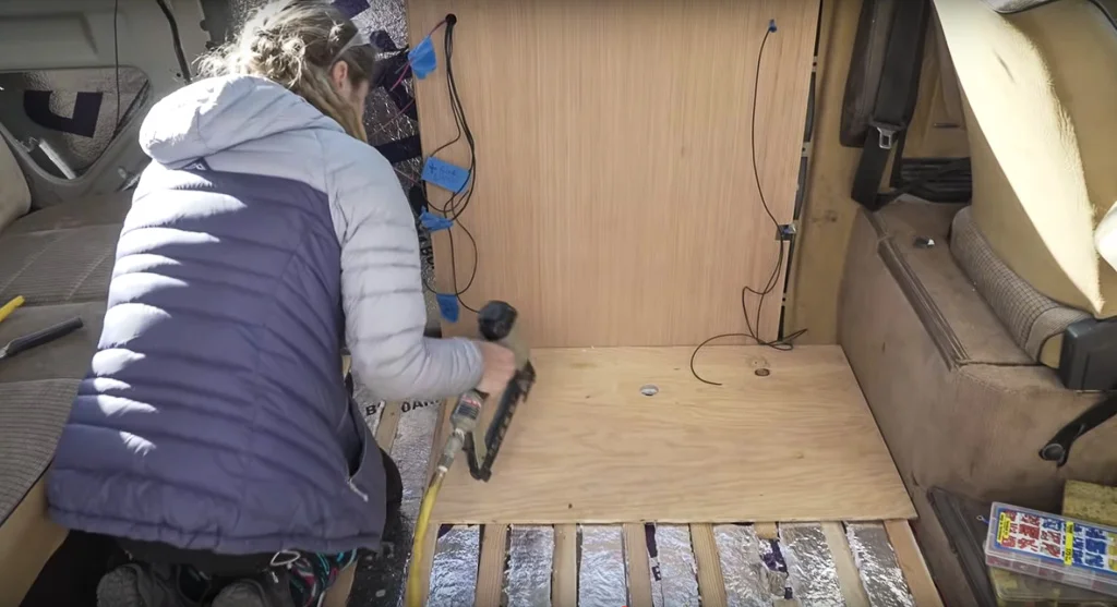 Here we are using a piece of plywood where the cabinet is going to go. That way, we make sure that we have enough visible matching flooring pieces from the Gate we found.