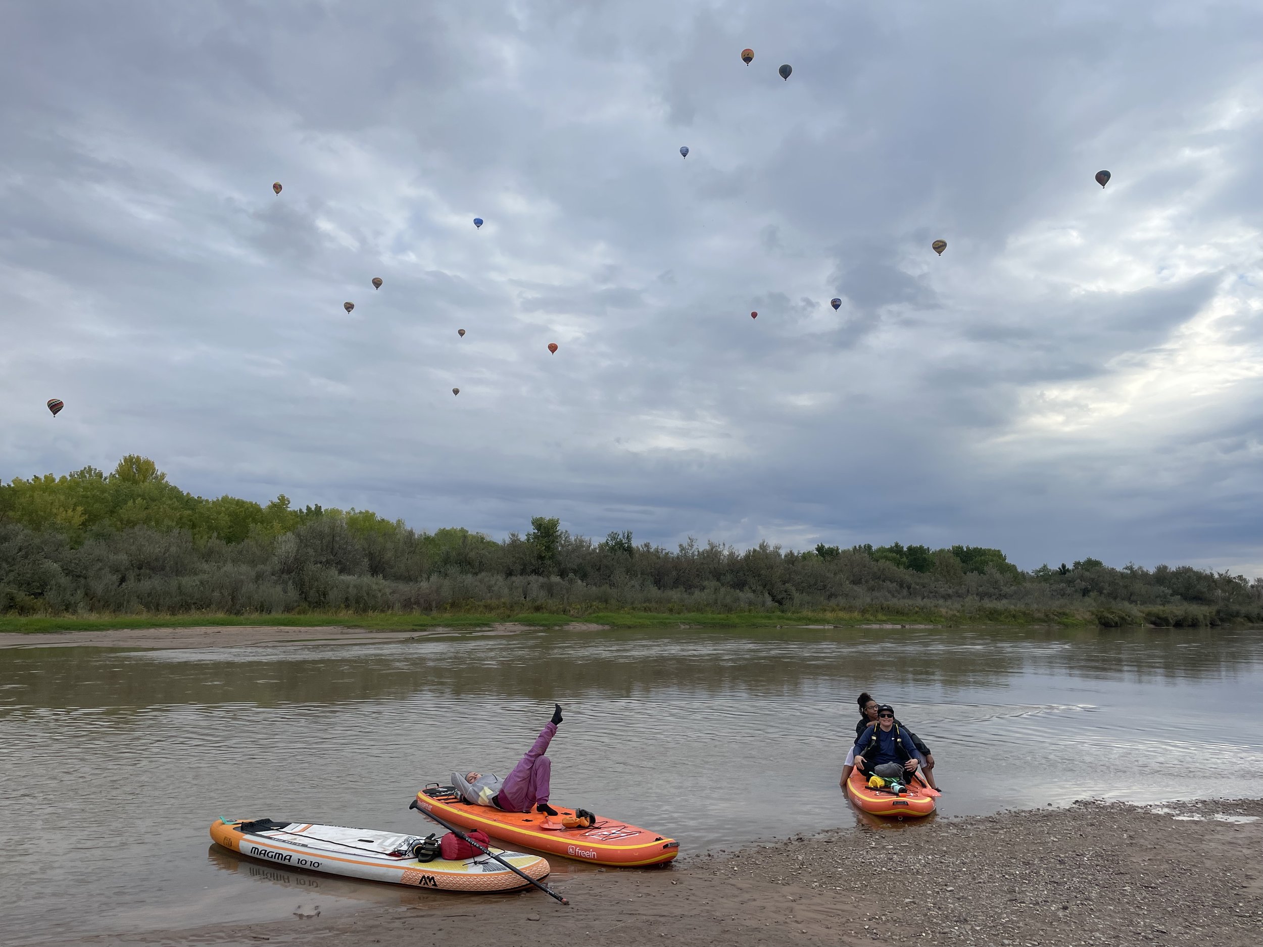 Watching balloons from our kayaks on the rio grande