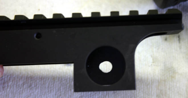 The hole in the rail needed opening up to match the hole pattern of the PS90