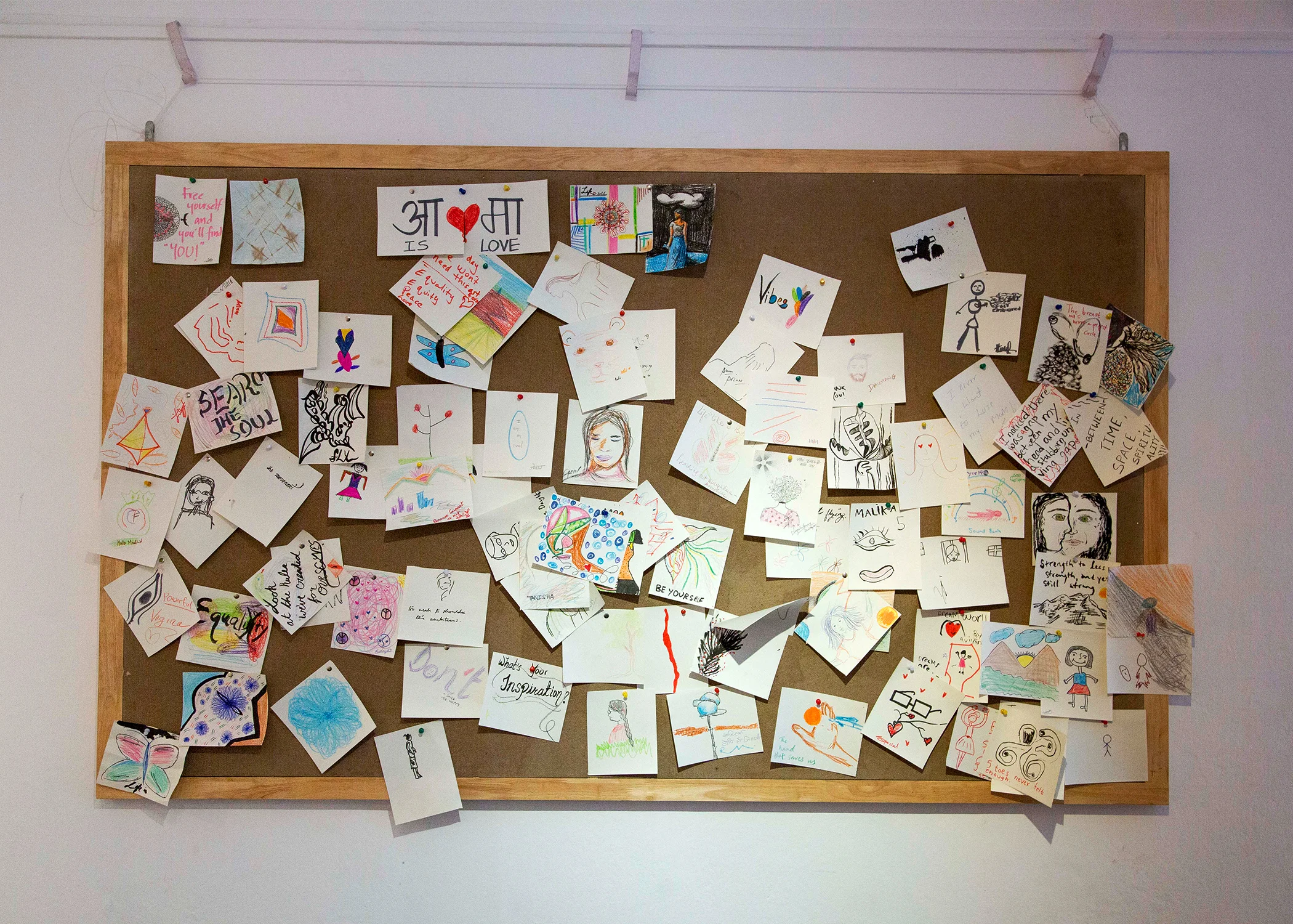 Self-portraits made by visitors to the gallery that accumulated throughout the exhibition.