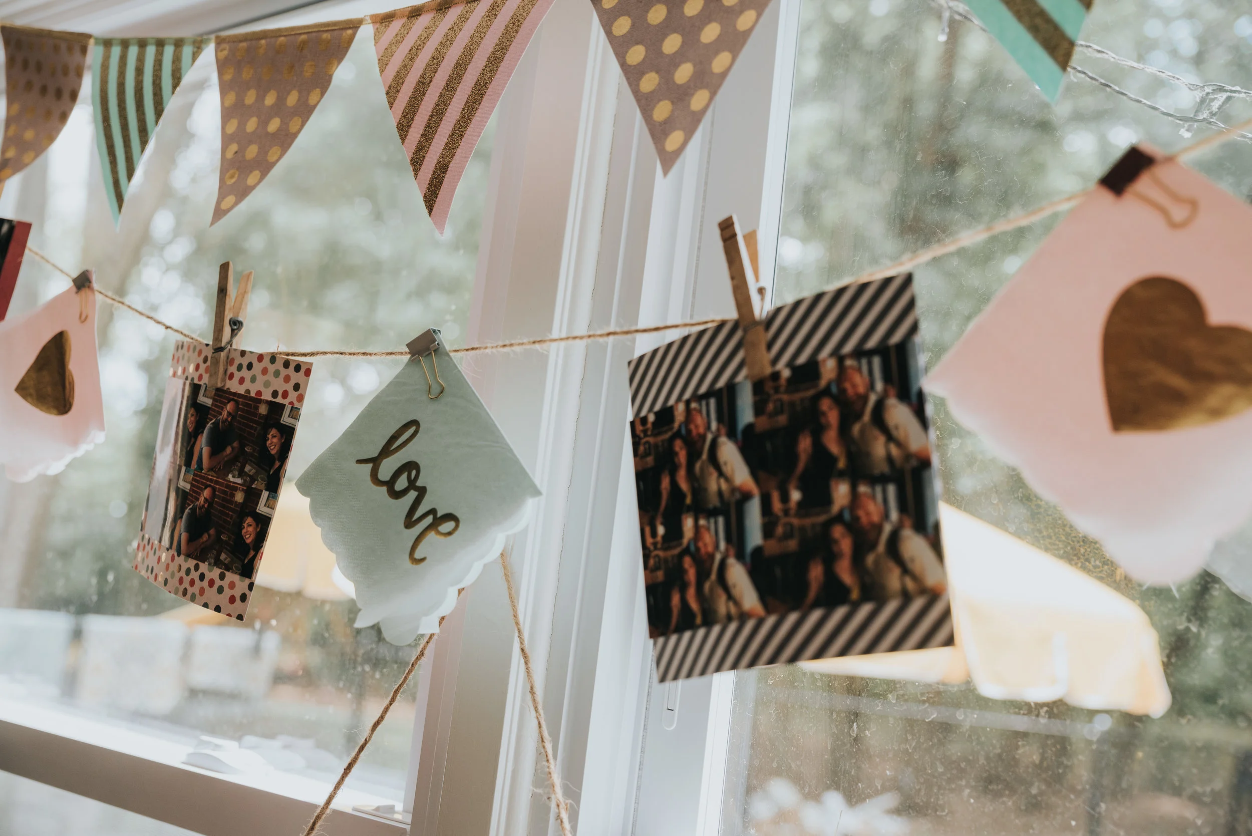 I used cute "love" napkins in the garland and pics I printed out from the couples' website. 