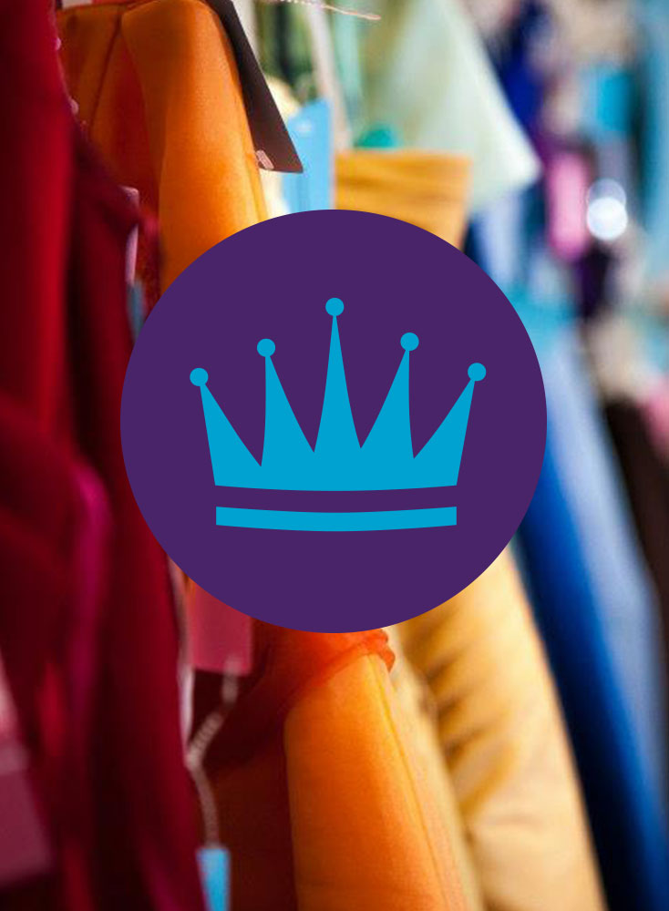 The Cinderella Project logo of a crown in front of dresses.