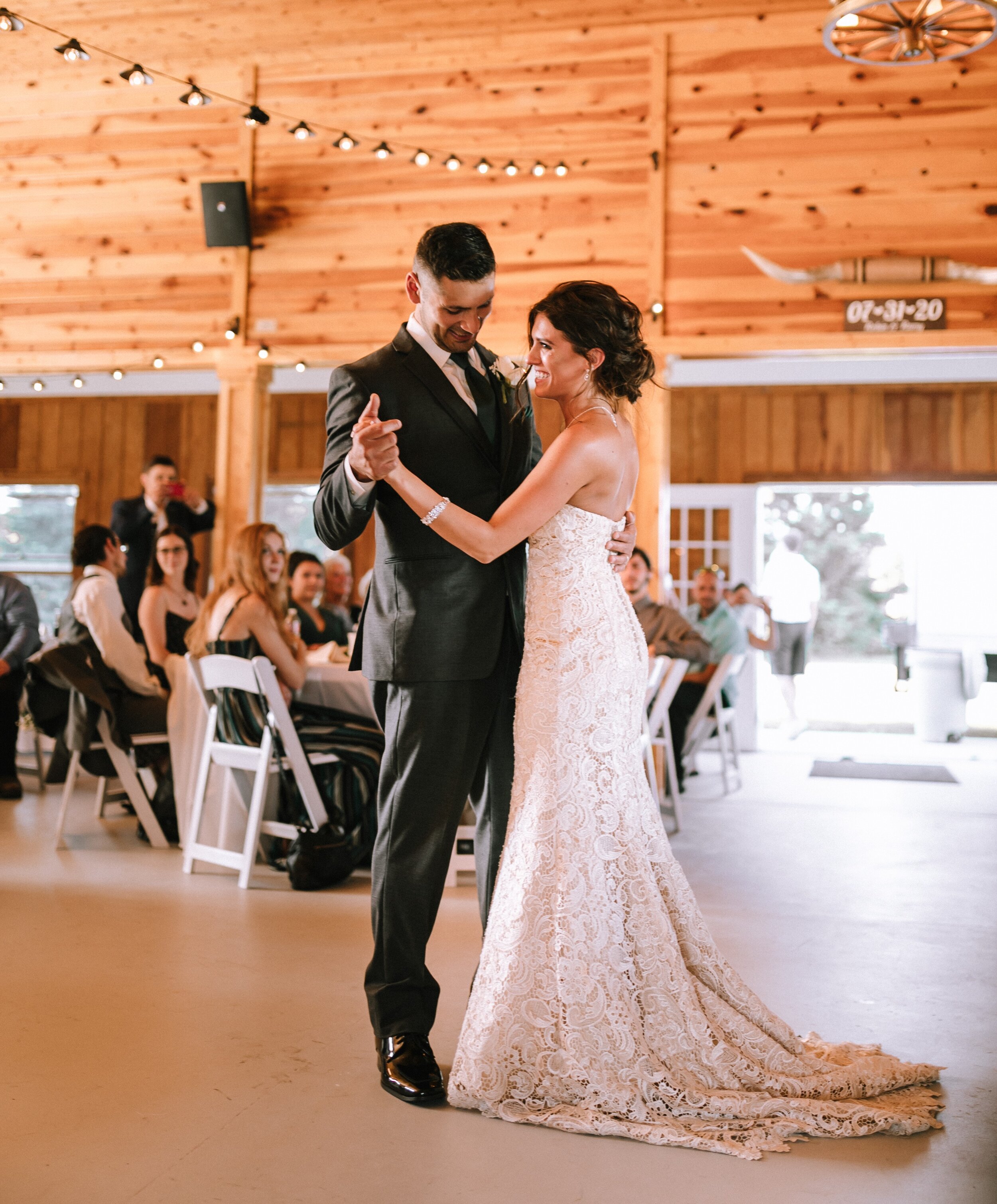 bride and groom first dance in michigan barn