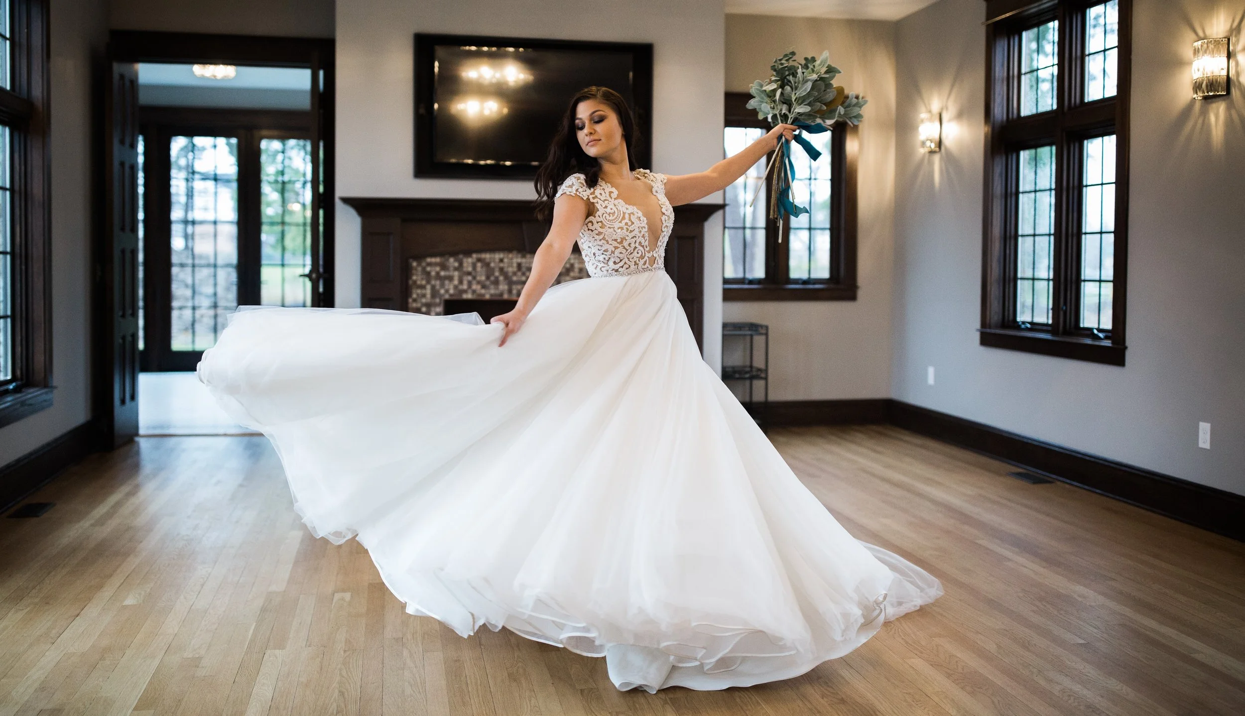 bride in gown on window sill