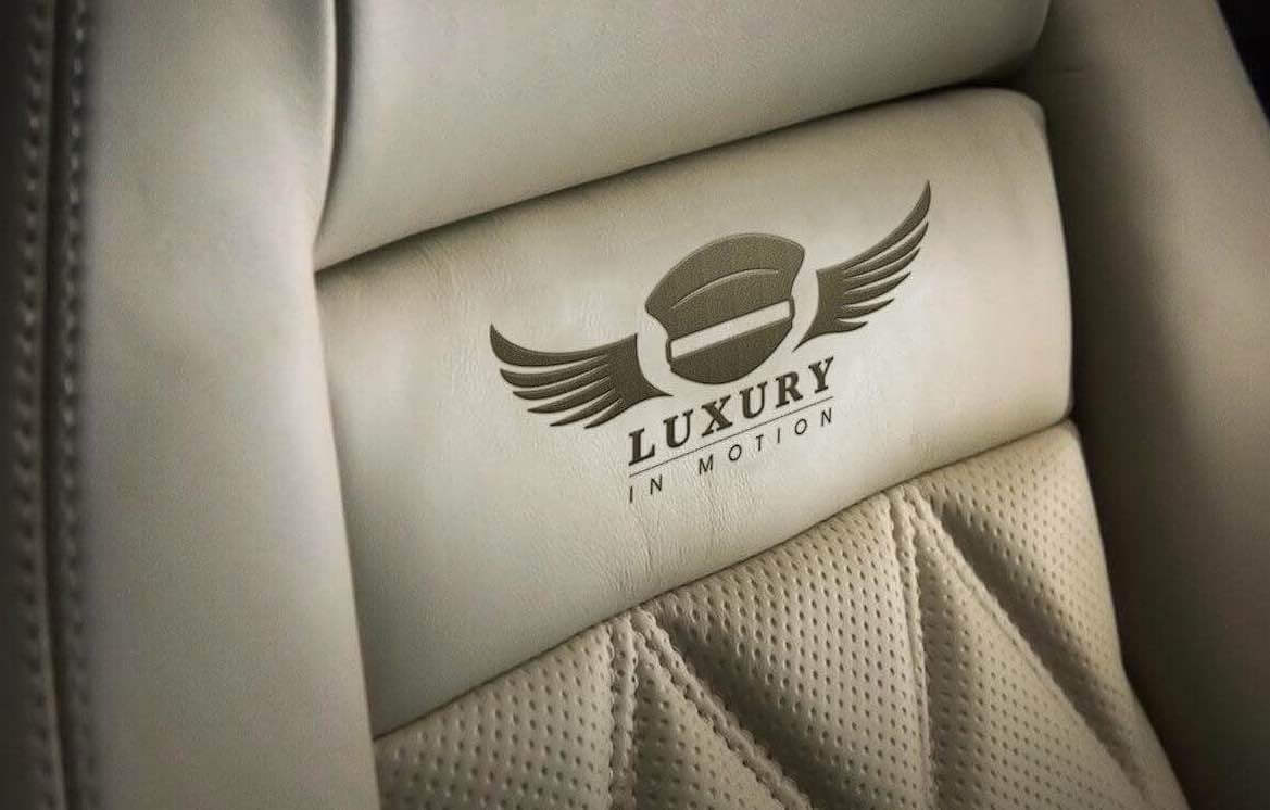 Luxury-in-Motion-surrey-4x4-wedding-car-hire-leather-seat-logo.jpg