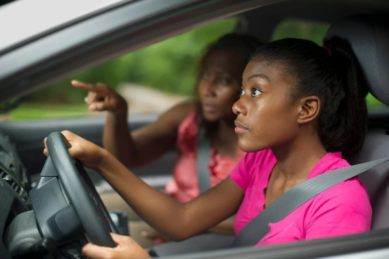 driving girl in pink.jpg