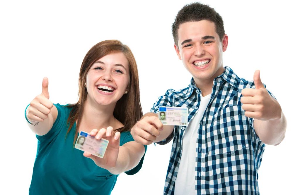 Boy-and-Girl-Teens-Holding-Drivers-License-with-Thumbs-Up.jpg