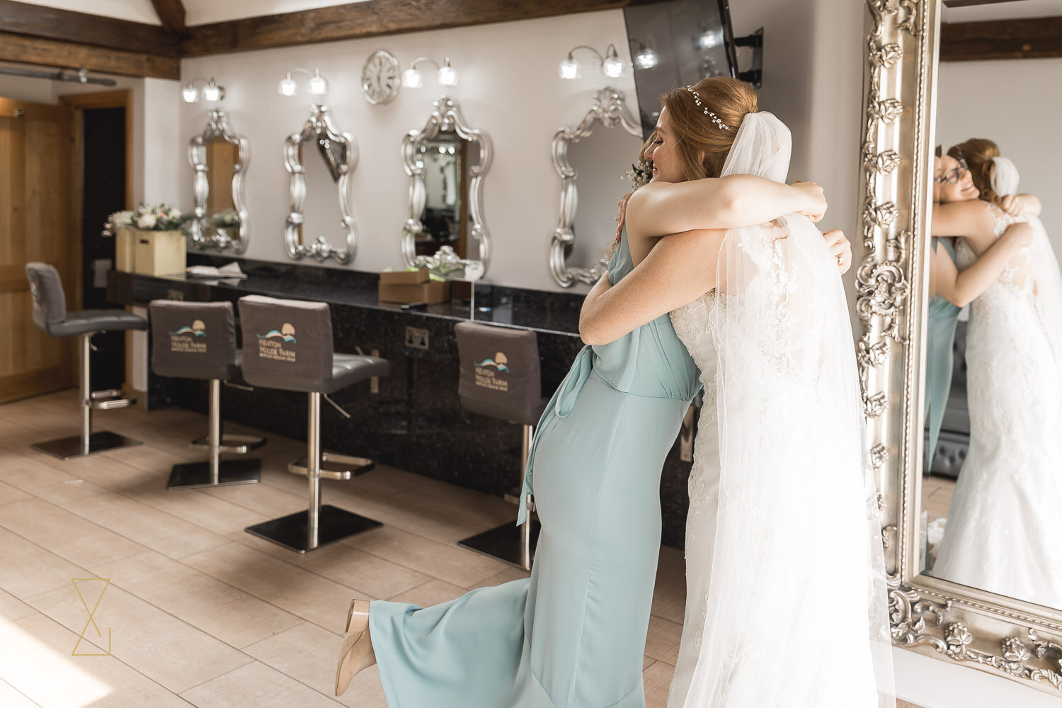 Bride-and-bridesmaid-hug-wedding-morning-photo