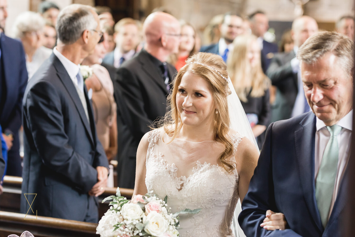 Bride-walking-down-aisle-Gawsworth-church