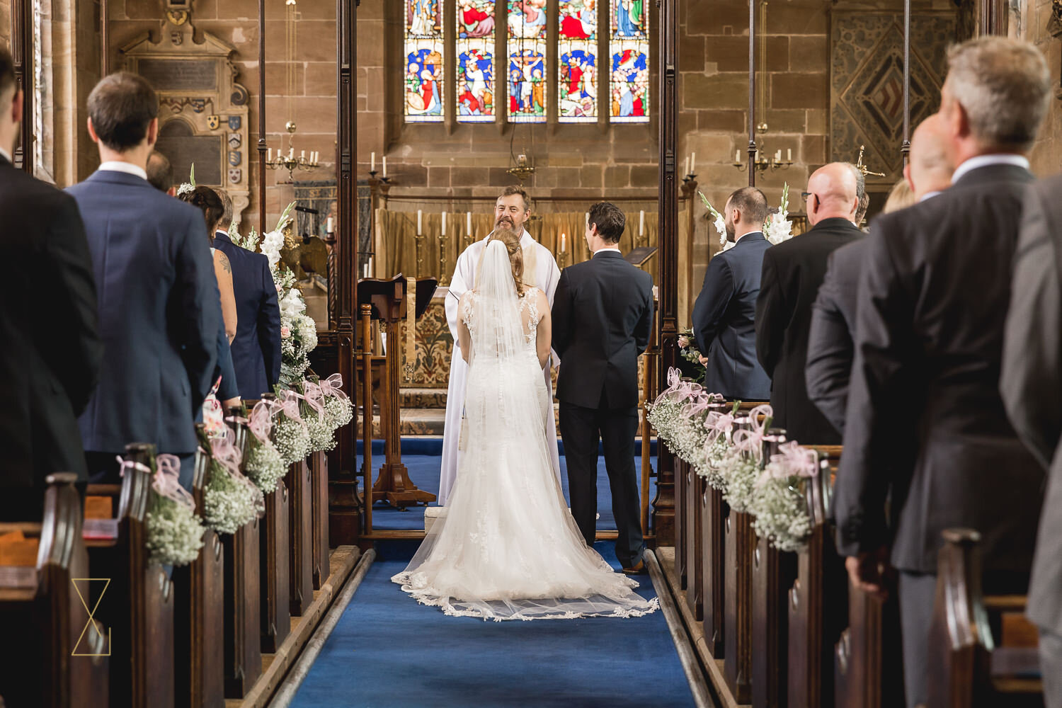 Bride-and-groom-at-altar-St-James-Church-Gawsworth