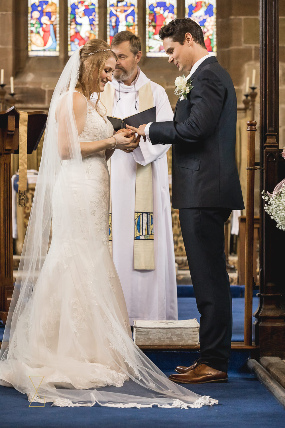 Exchanging-wedding-rings-Gawsworth-church-wedding