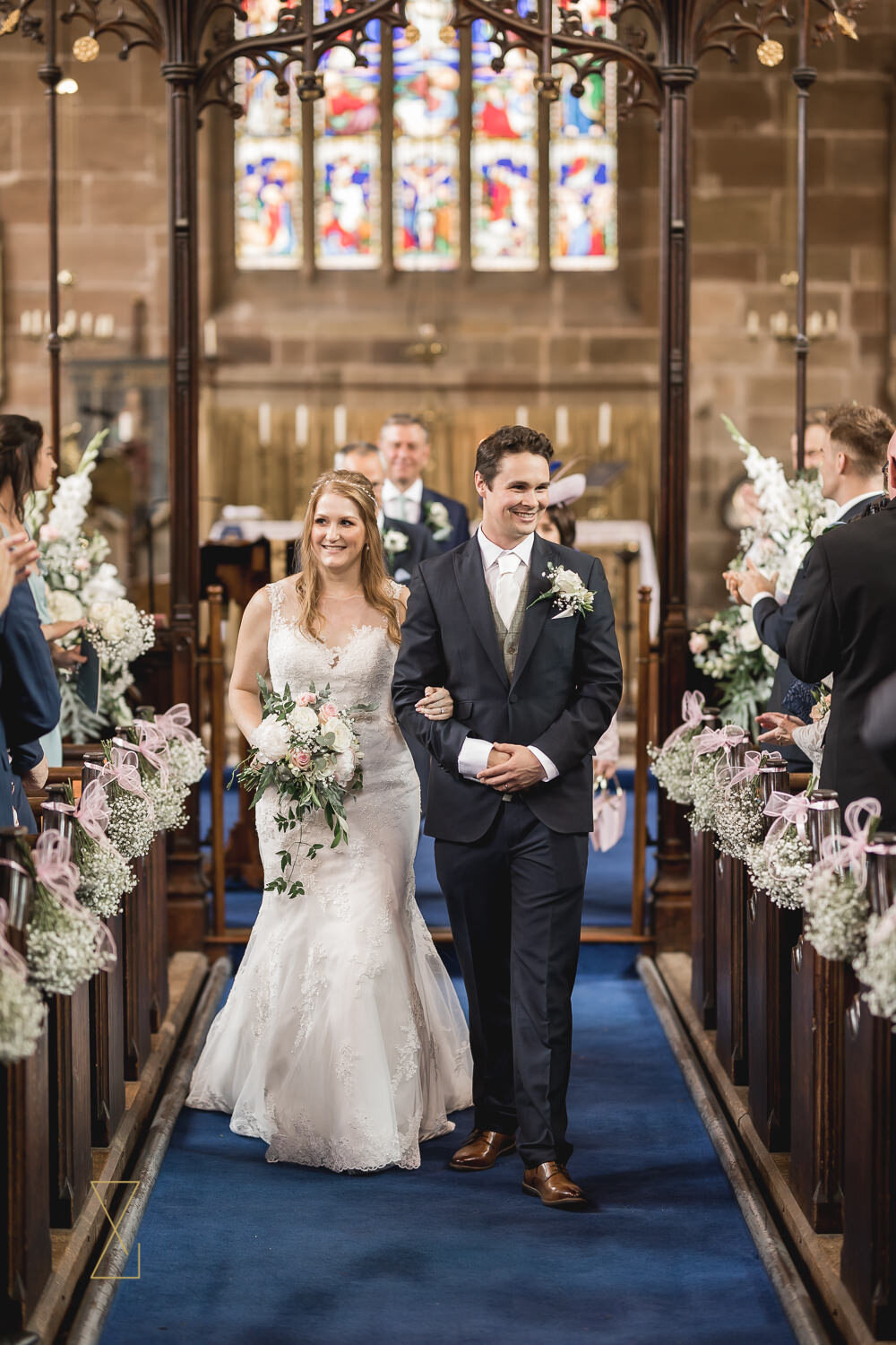 Bride-and-groom-leaving-Gawsworth-church-wedding