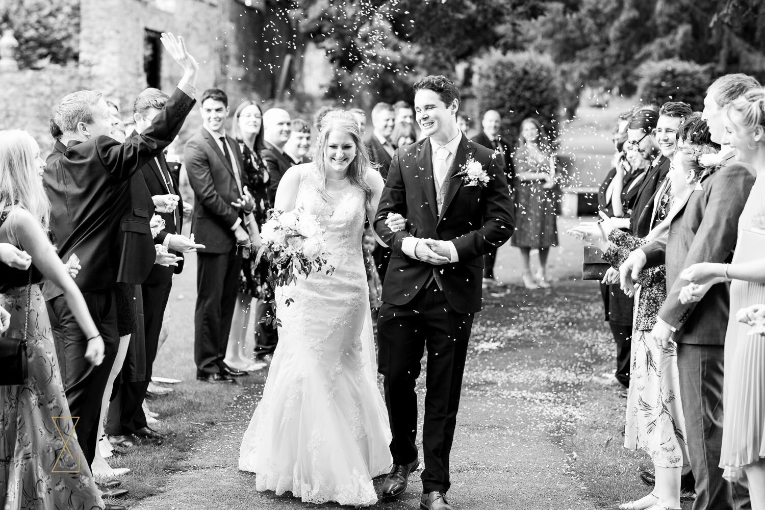 Throwing-confetti-photo-St-James-Church-Gawsworth-wedding
