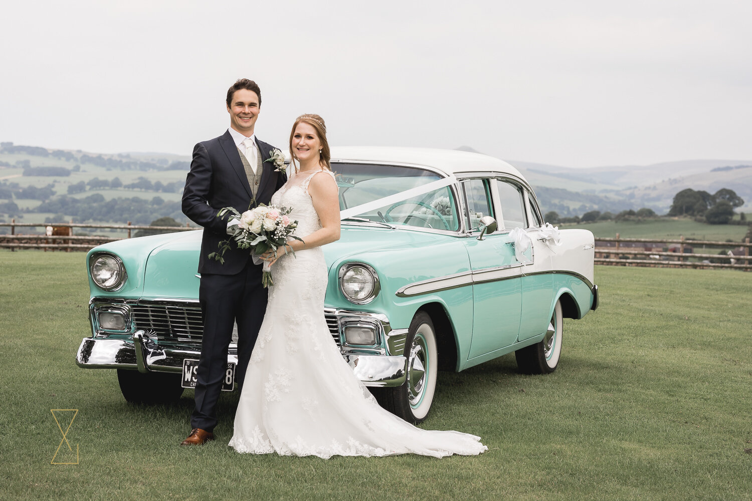 Bride-and-groom-in-front-of-vintage-Chevrolet-wedding-car