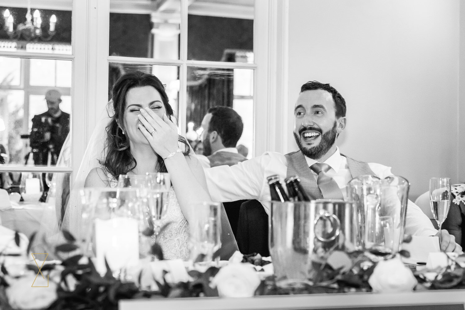 Bride-laughing-at-funny-wedding-speech