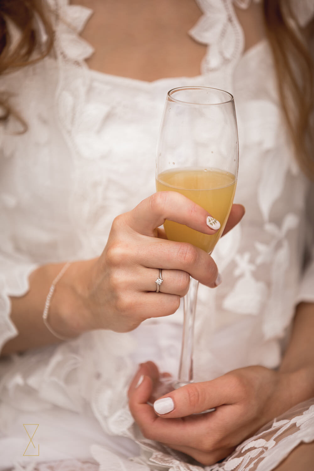 Bride-champagne-glass-wedding-morning