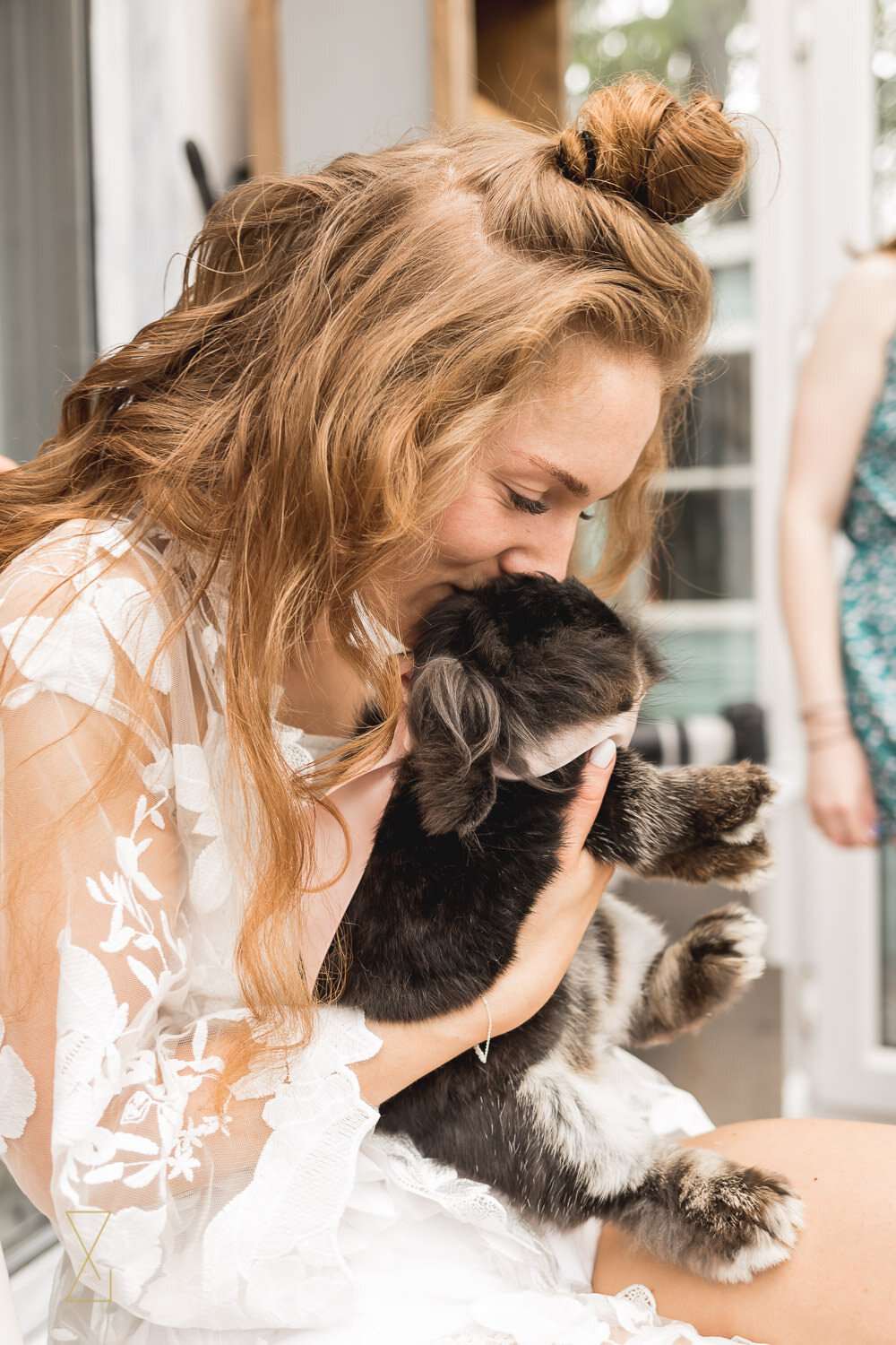 Bride-cuddling-rabbit-wedding-morning