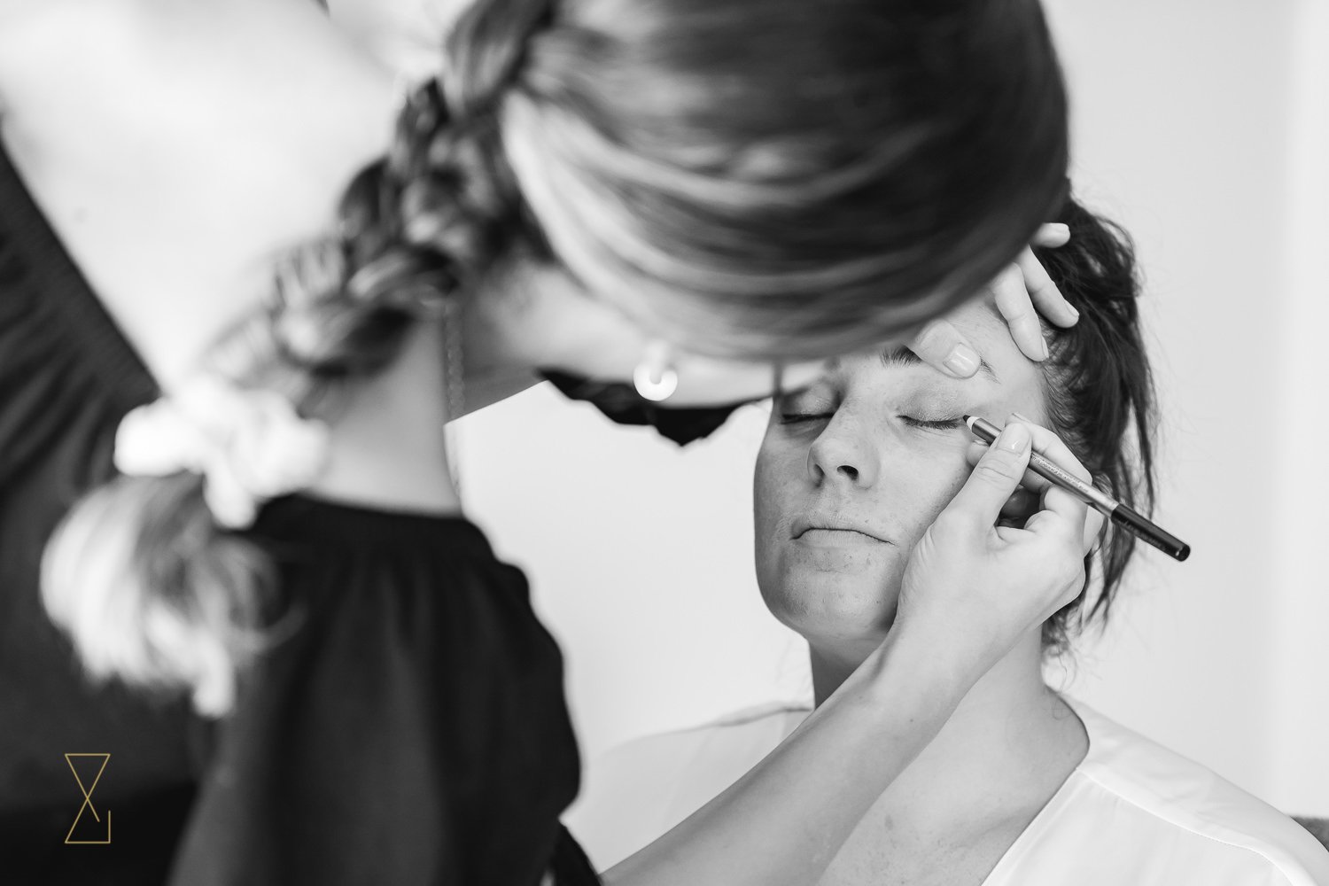 Bride having makeup wedding morning