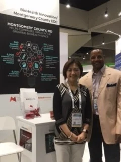 Lily Qi and Steven Walker of Biologics Consulting at MCEDC Booth.jpg