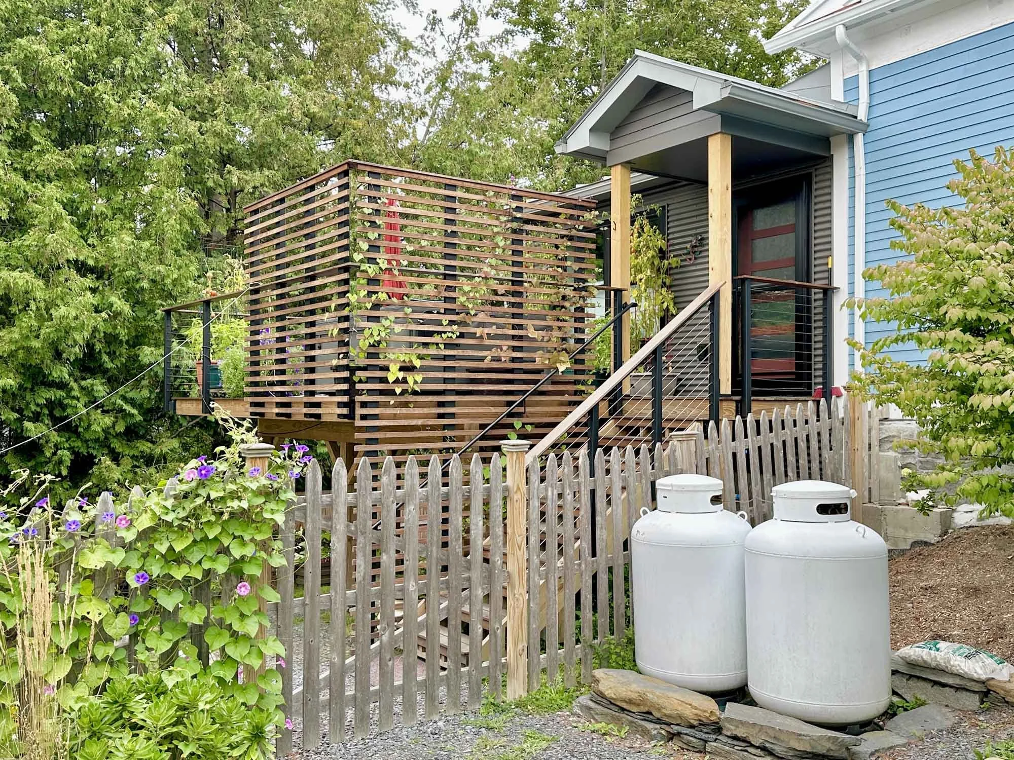 Closeup view, rear Arocordis Design addition and new side deck and entry porch.