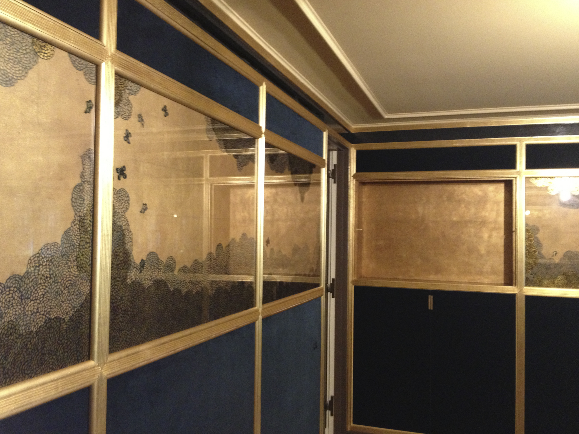 Dining room with overlapping gold-leaf and hand-painted panels, New York