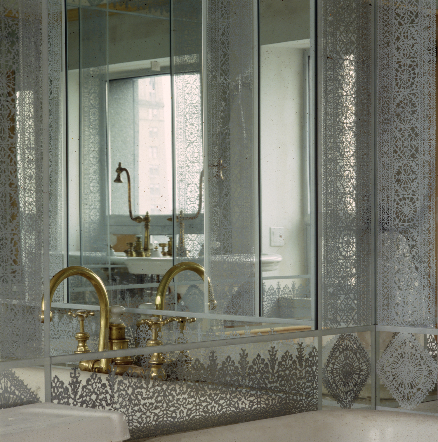 Lace borders hand-painted on glass and silver-mirrored