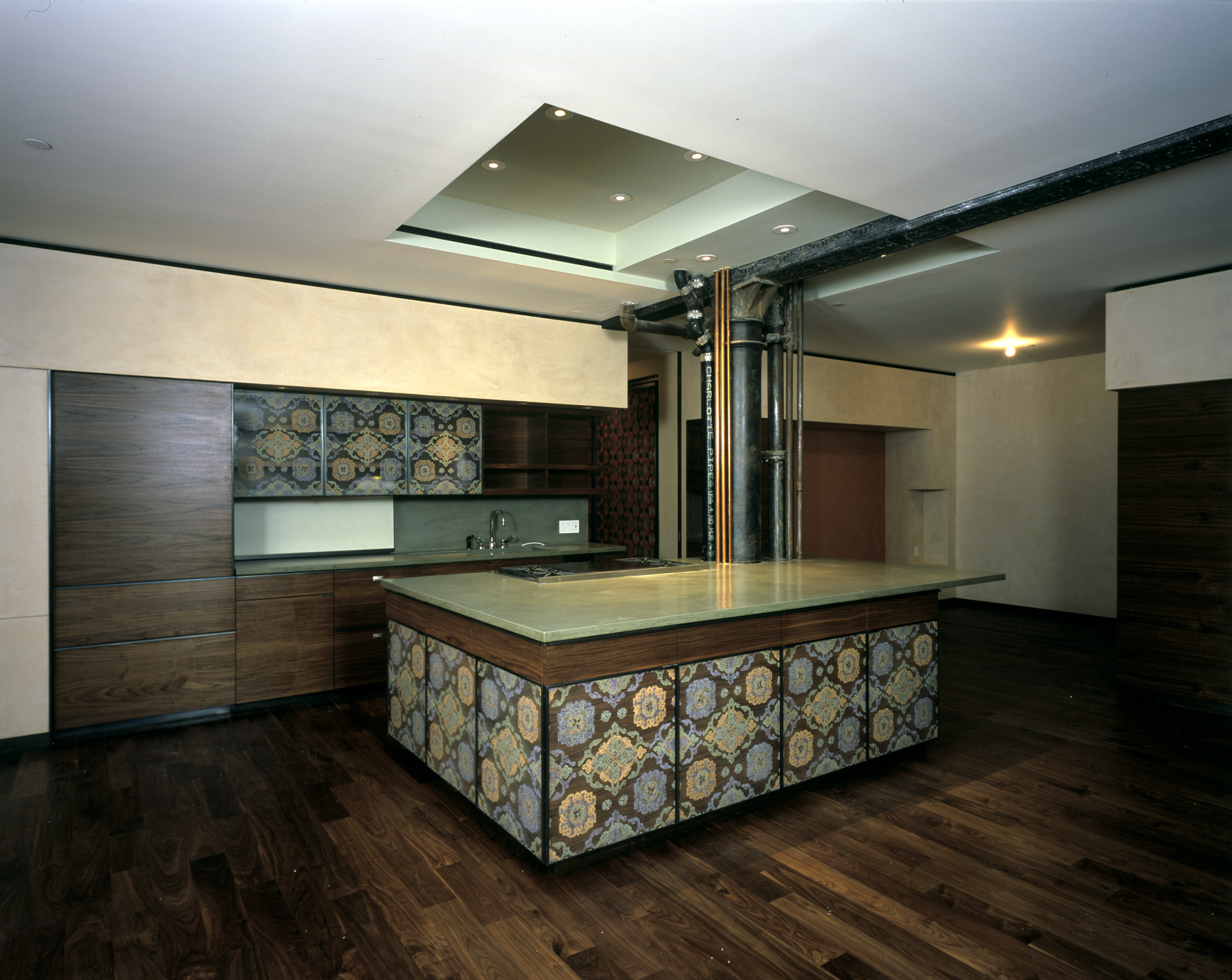 Kitchen with hand silk-screened glass and overlapping walnut panels, New York
