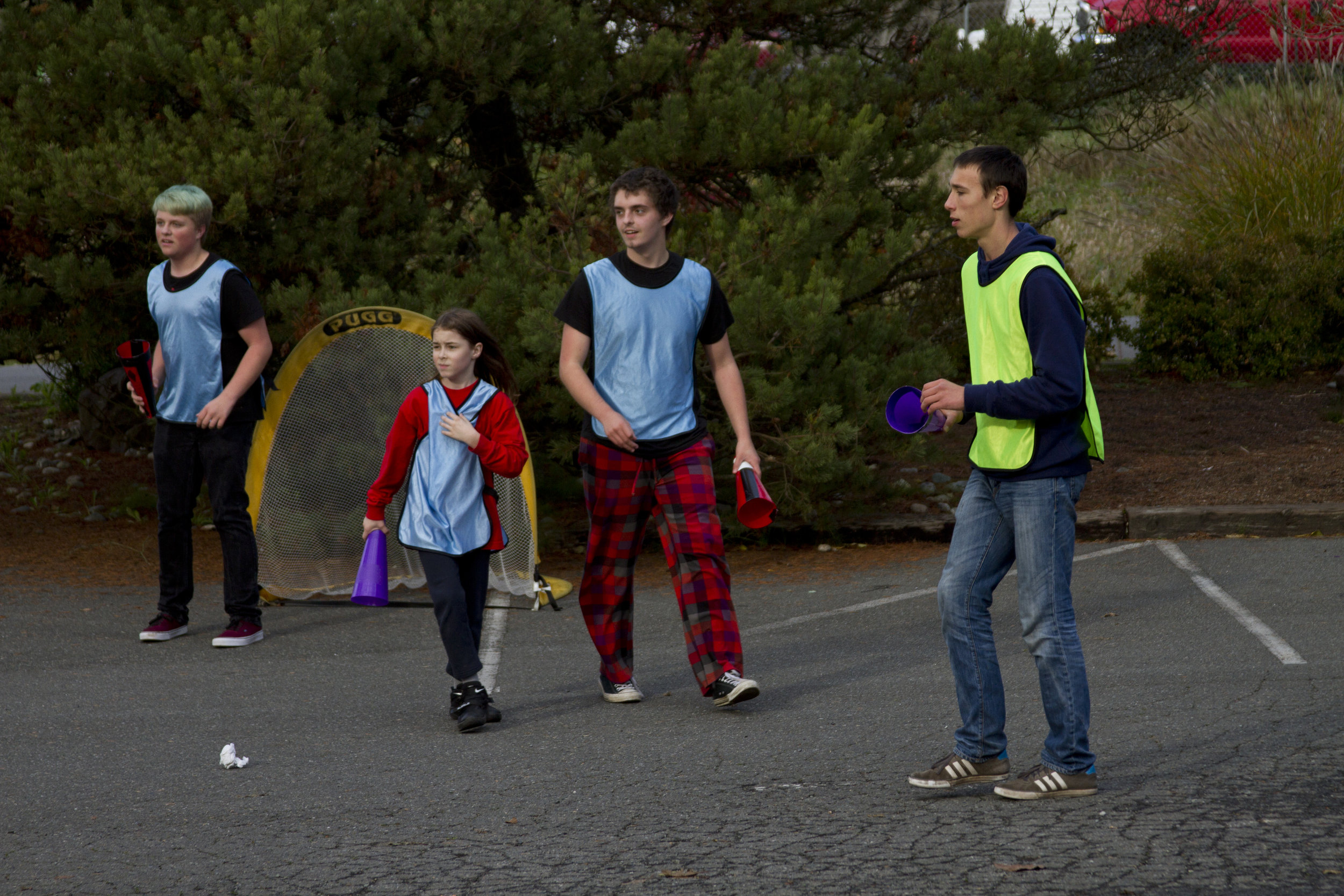 Four students play an invented sport called "Coneball."