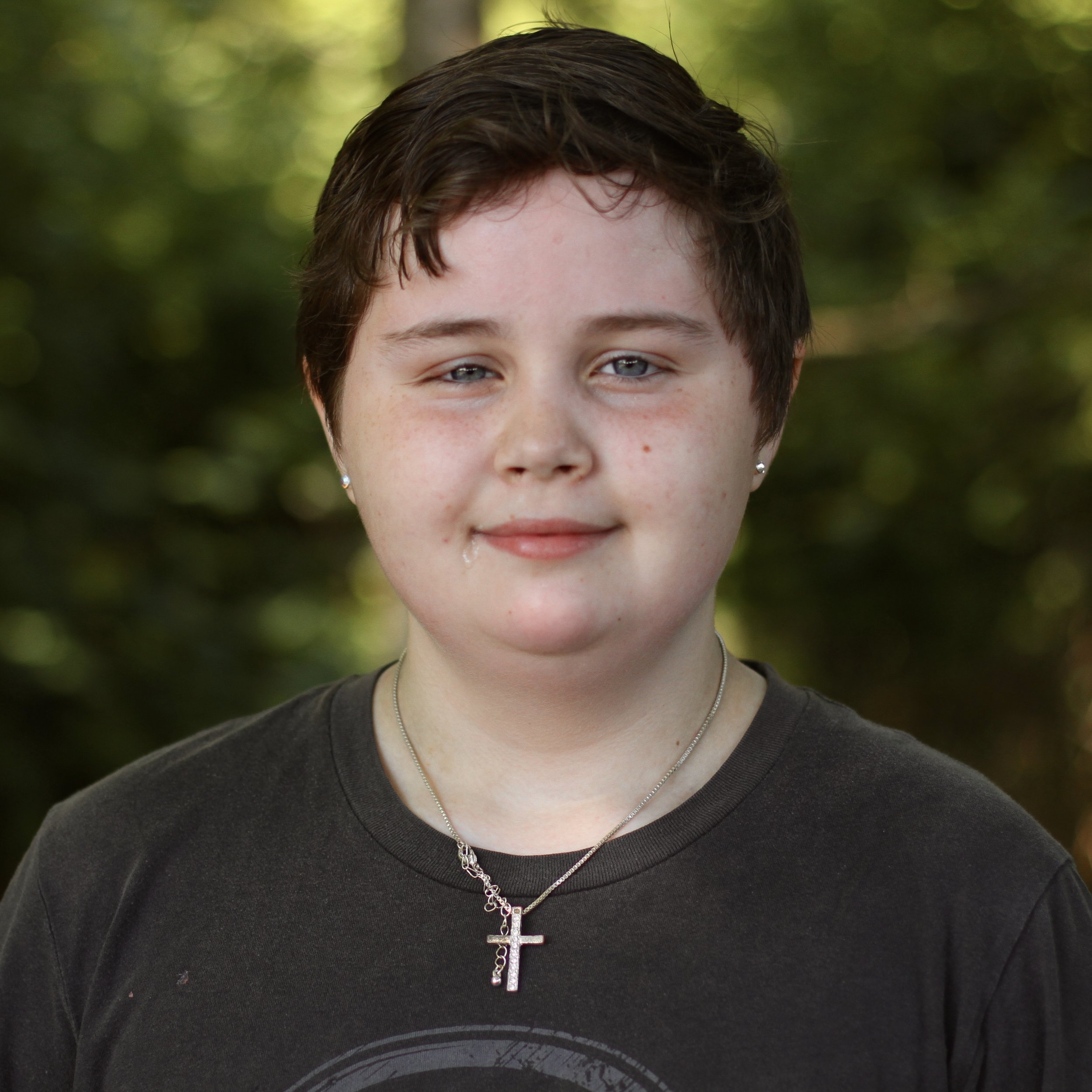 Smiling student with short brown hair