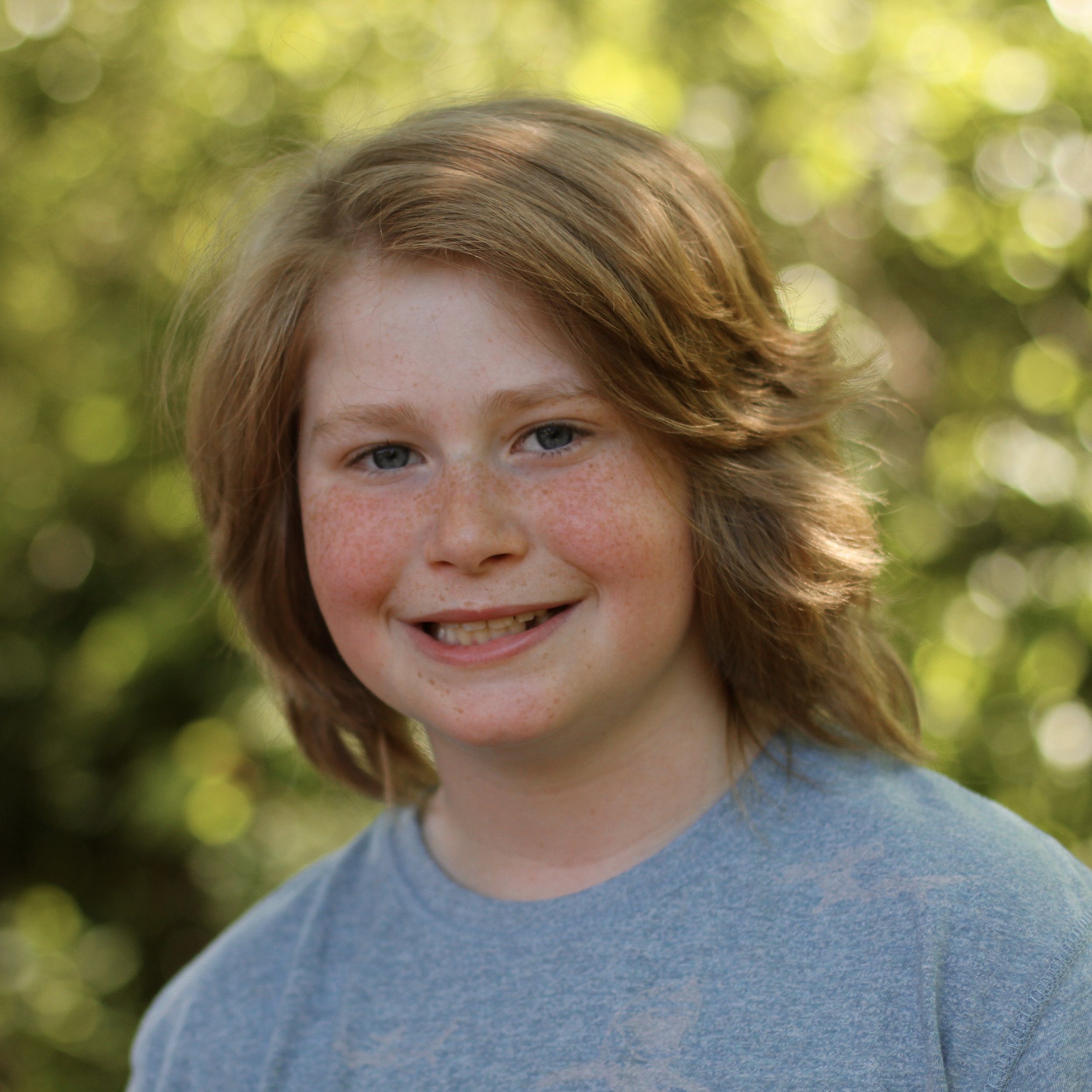 Smiling student with medium blond hair