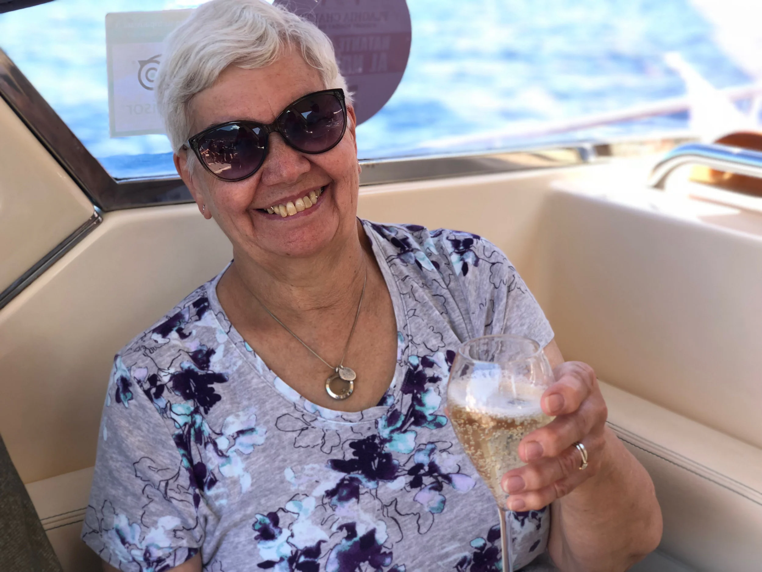 chris enjoys a bubbly while cruising the amalfi coastal waters