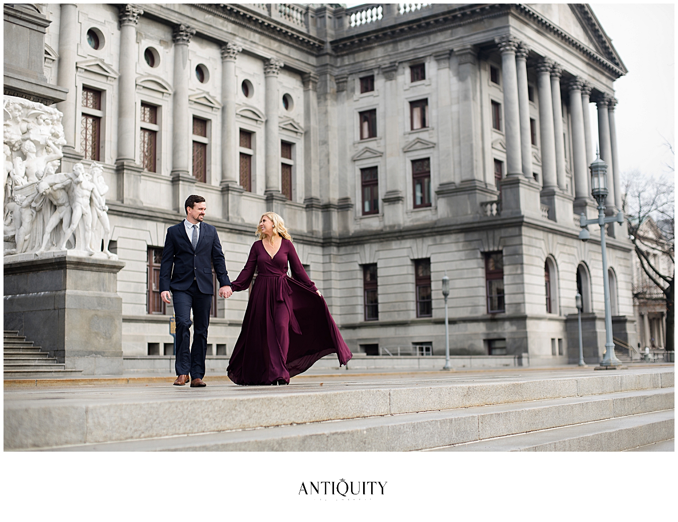  a young couple strolling in front of the capitol building in harrisburg 