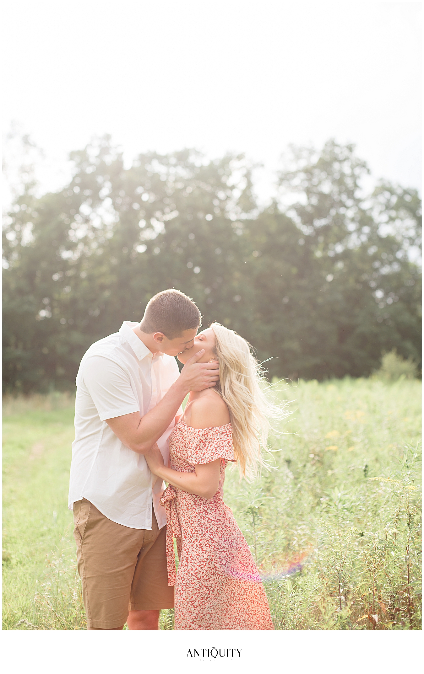  bride and groom to be in a field at montour preserve 