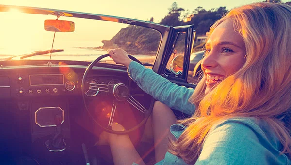 woman-driving-car-at-beach-600x342.jpg