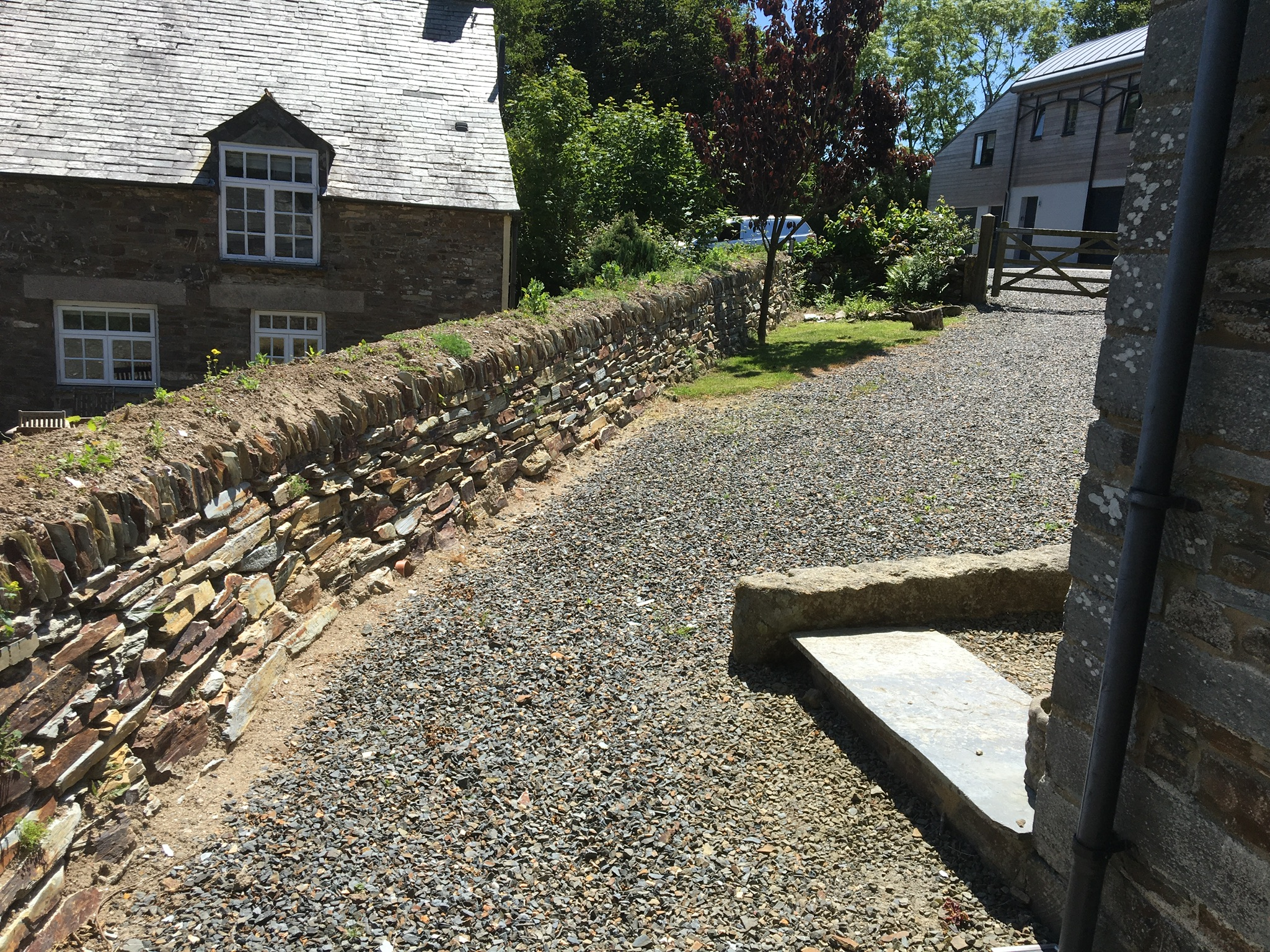  Wall dividing two properties, Cornish hedge using Trebarwith Road Quarry Stone. 