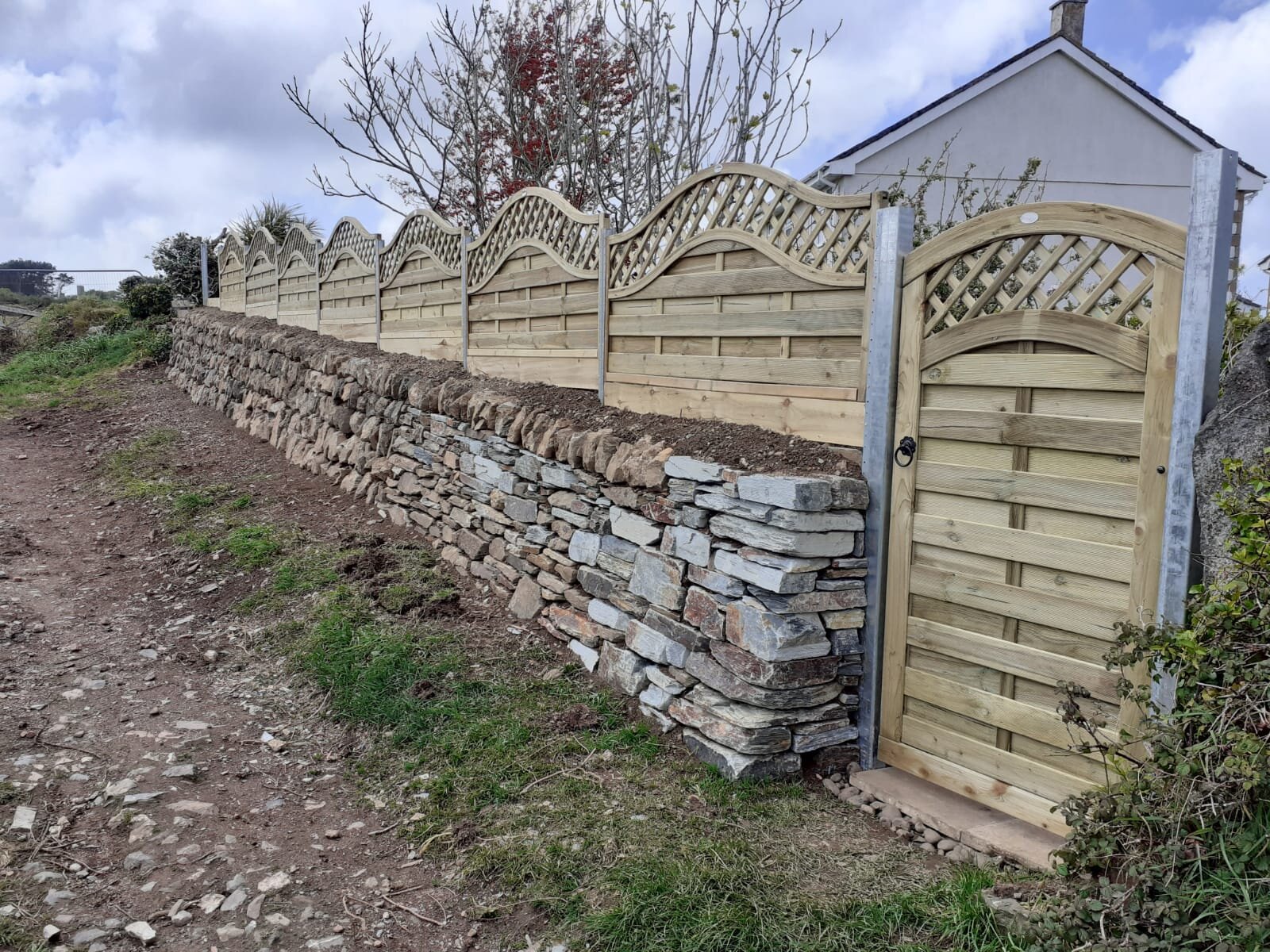Wall with gate and fence