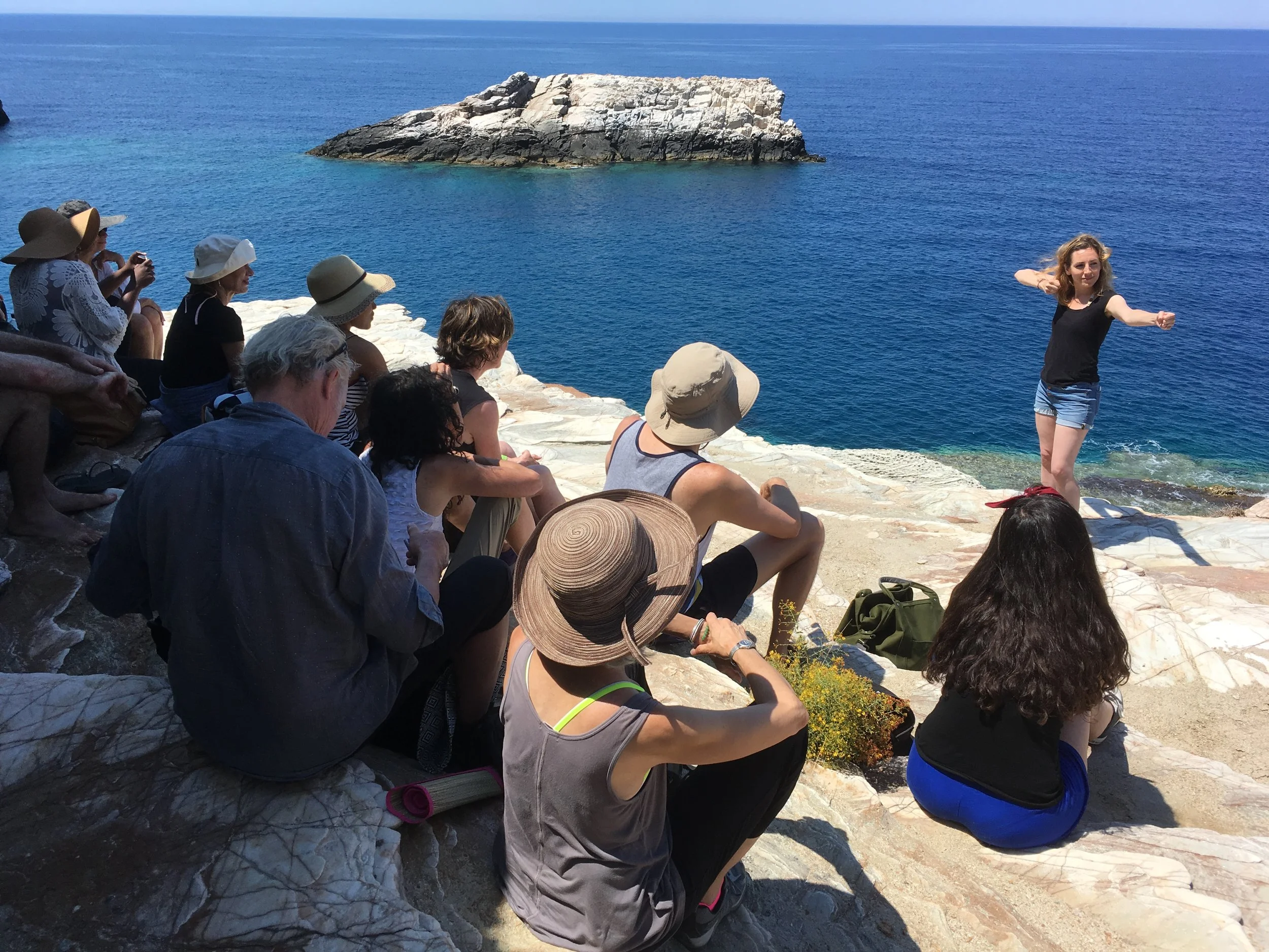 Students perform at Livadaki Bay.