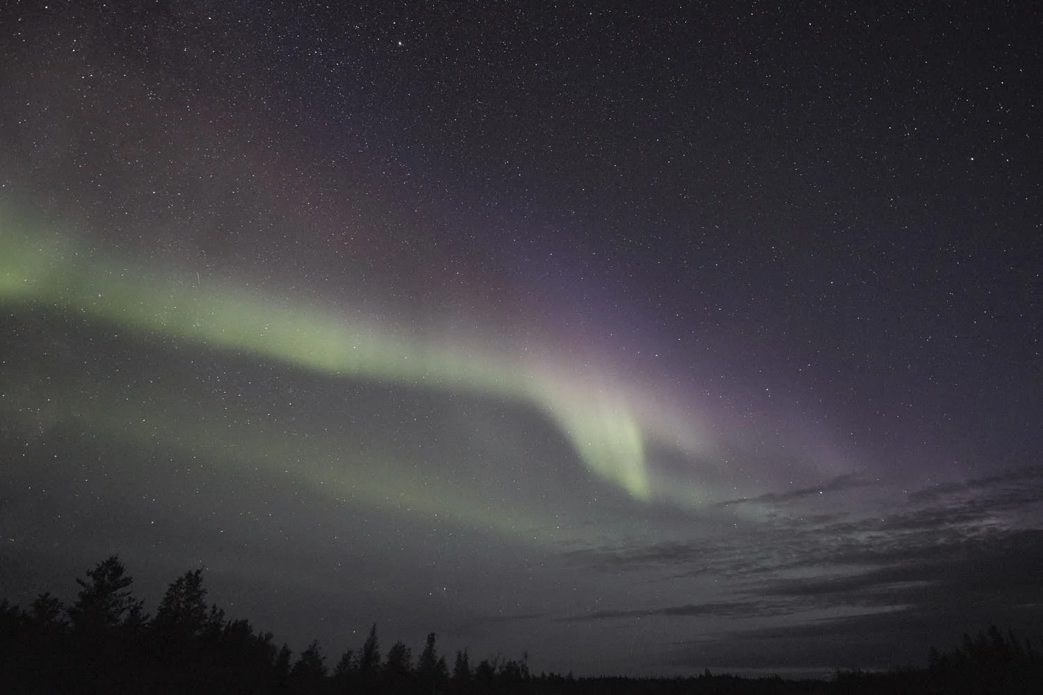 This is, not perfect, but that same photograph edited much closer to how I remember actually viewing the aurora in real time with my naked eyes in that moment. Very faint greens were visible, and the reds and purples were much more just a different ‘hue’ than a distinctly identifiable colour.