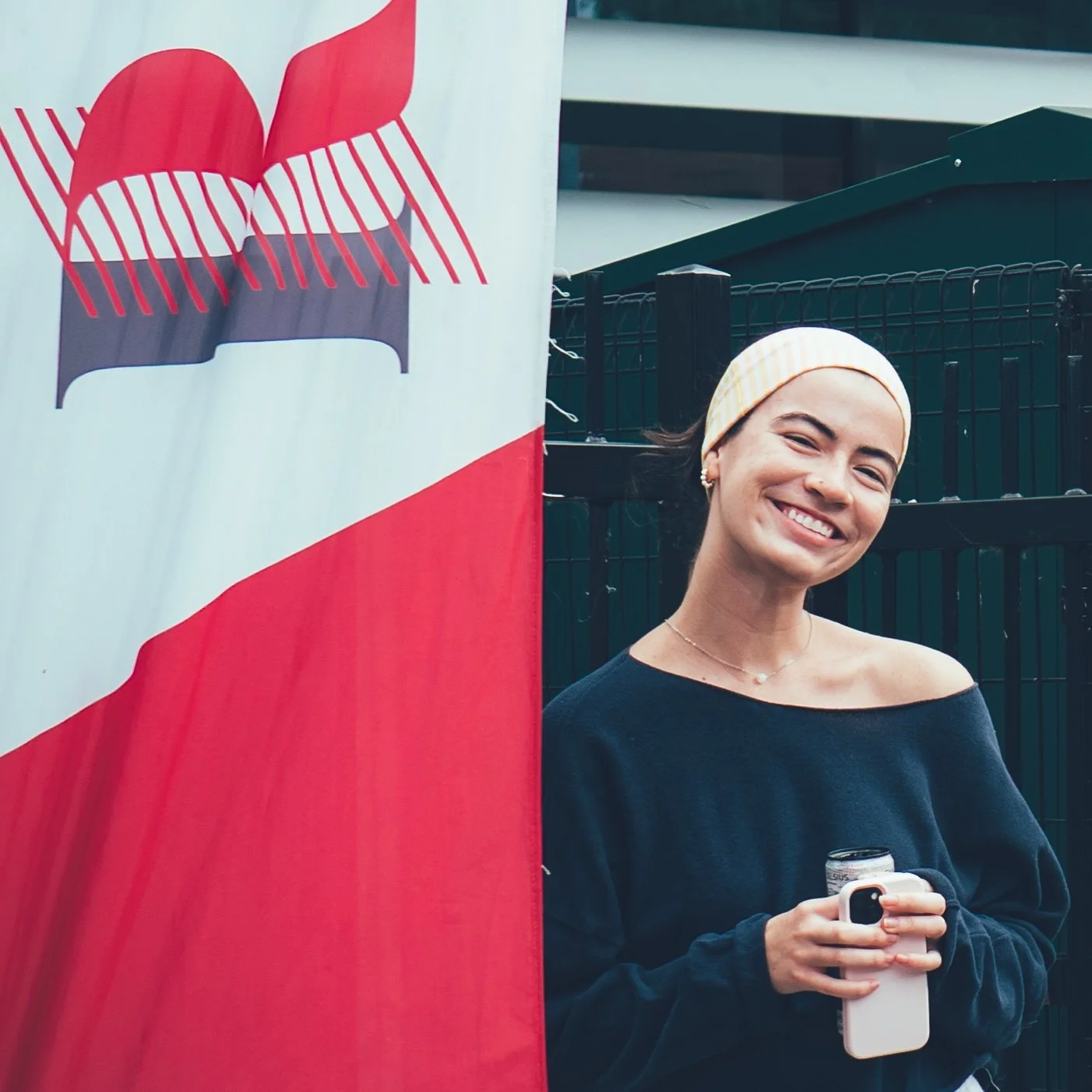 redeemer flag and person smiling