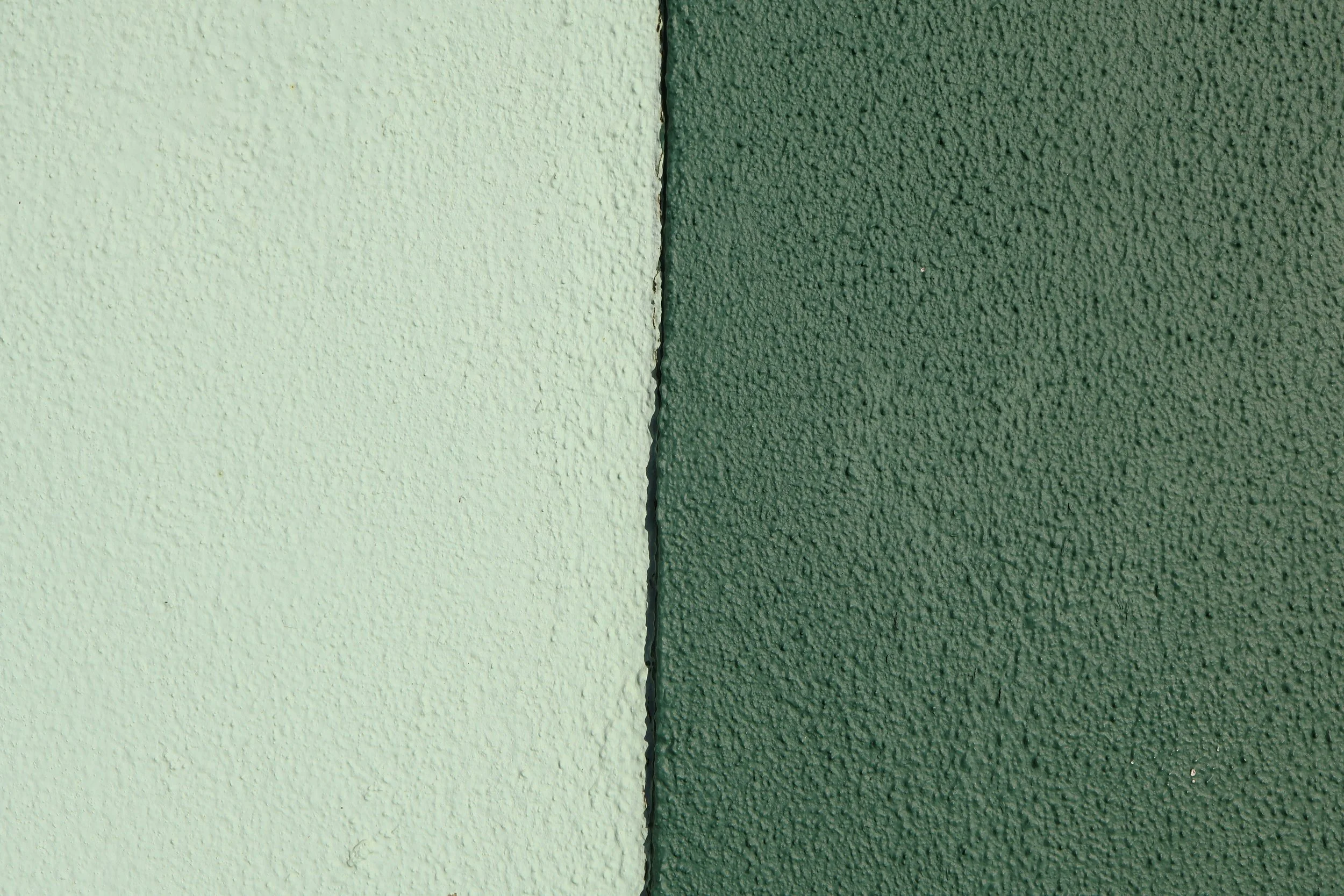 green wall with a line running through