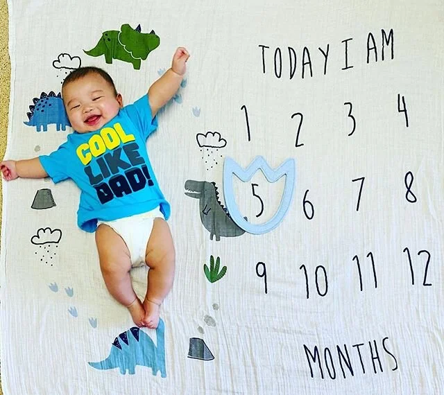 Rawr x5! What a super strong month with this mighty-saurus 🥰🦖 Our big boy has become a pro at constantly flipping over, arching his back, wanting to stand, and even sitting up on his own after we place him down. His grip strength is crazy and all t