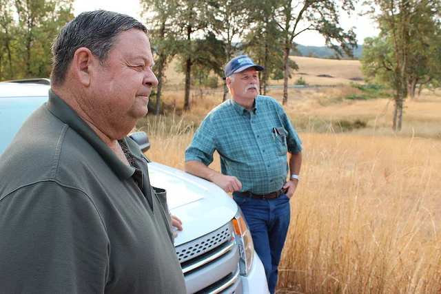Jeff Baxter (left) and David Chain review the conservation plan that transformed Baxter Ranch. NRCS photo by Spencer Miller.