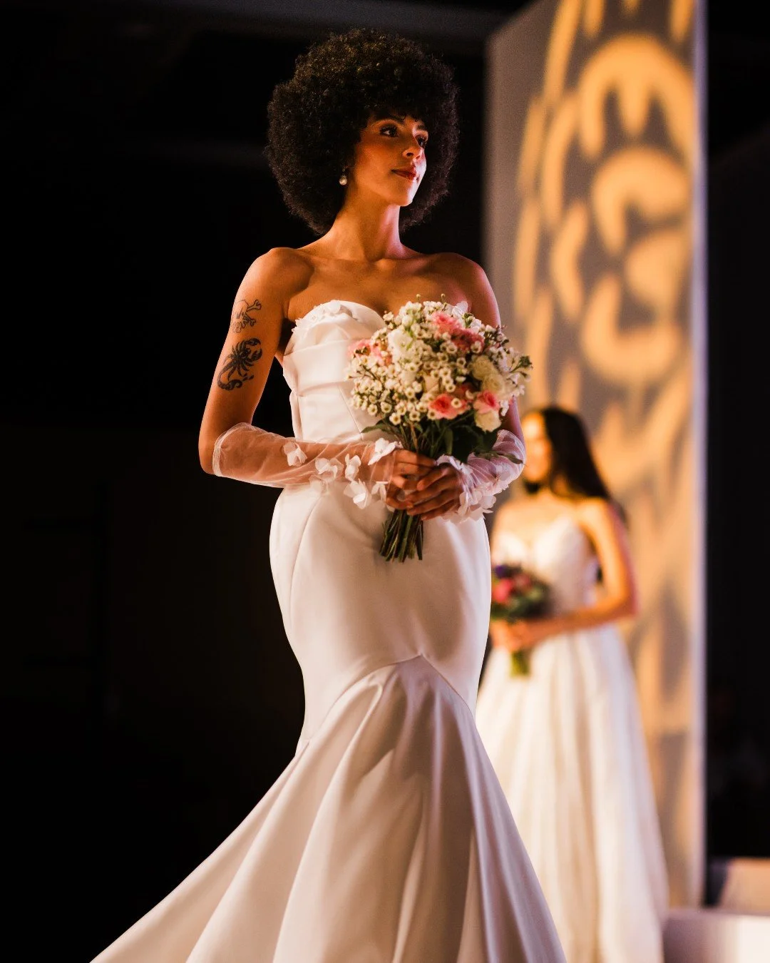 This silhouette. 😮&zwj;🔥

Sculpted. Sleek. Dramatic in motion.

From the clean neckline to that perfectly flared hem, every step down the runway felt powerful and effortless. Modern romance with just the right amount of edge.

If this is your vibe,