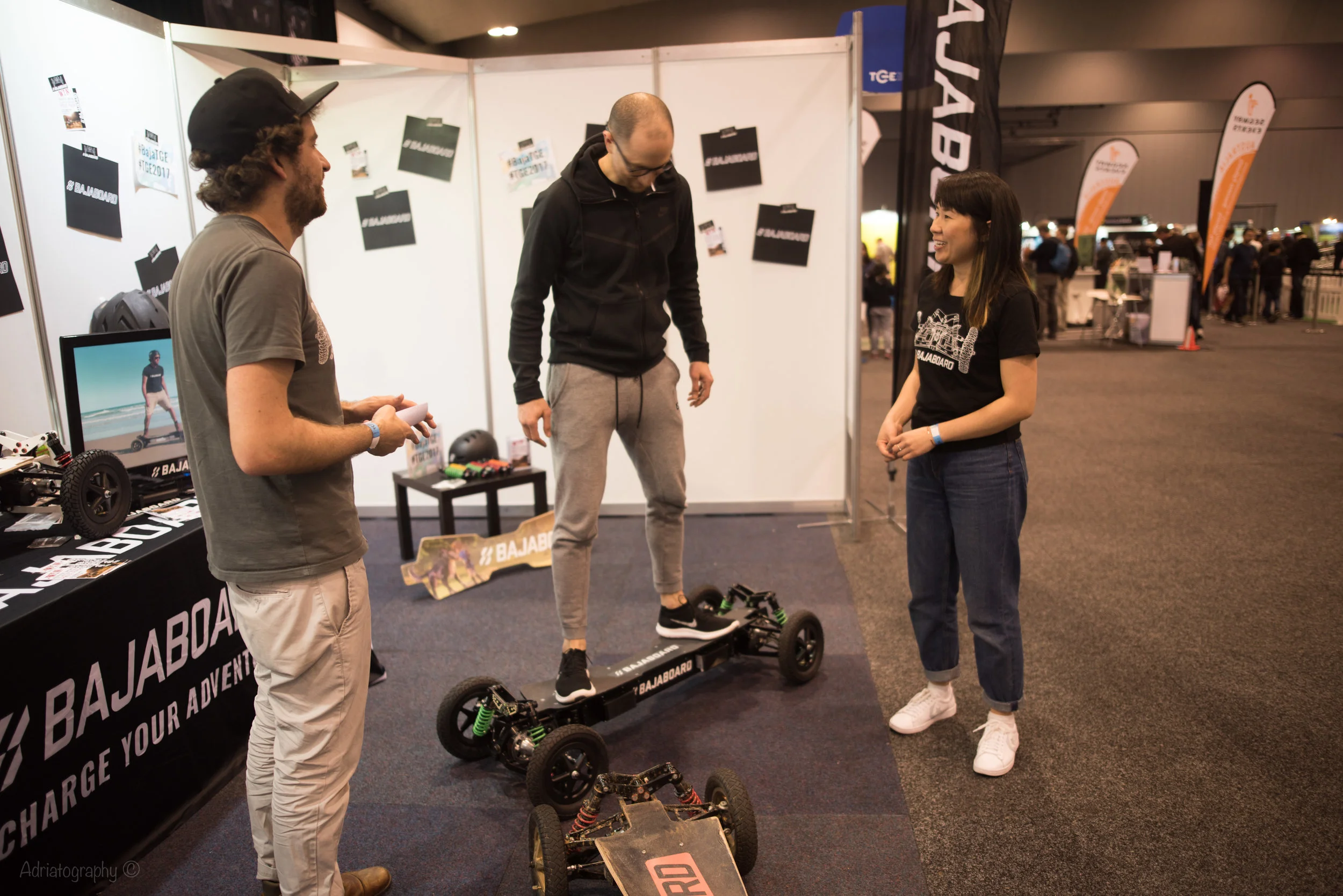 James and Jenny talking about how fast our board goes - it always wows people. Photo credit: Adrian Pinto