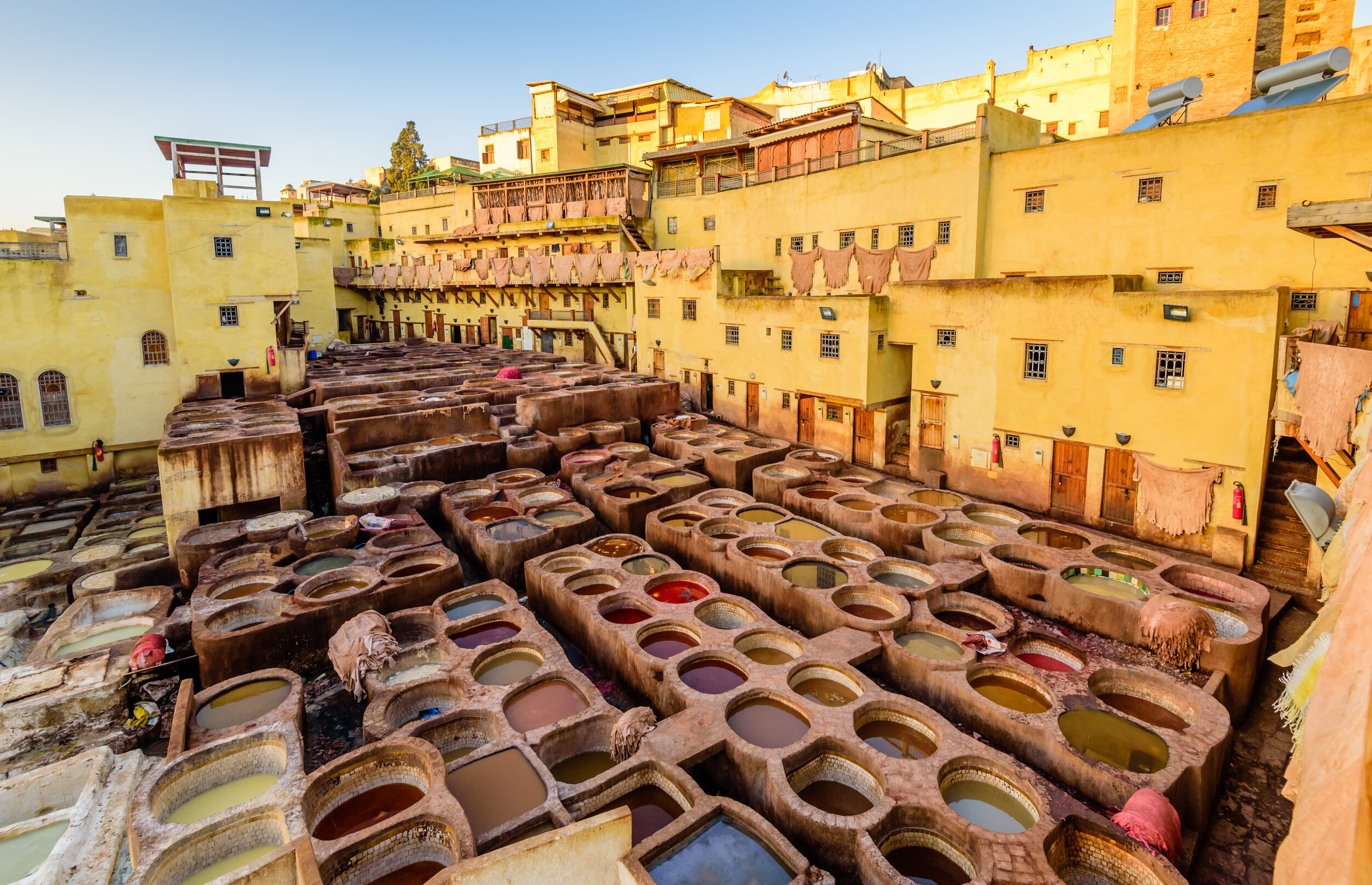  Dye reservoirs and vats in traditional tannery of city of Fez, Morocco 