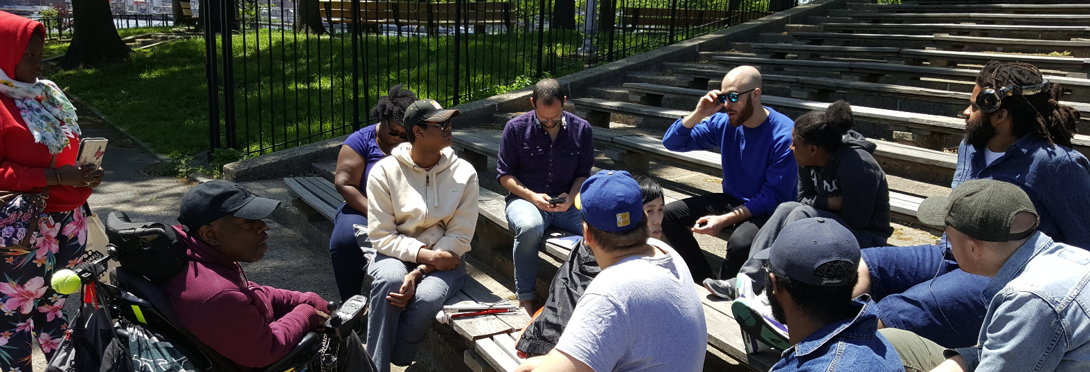 Reuben facilitates a discussion on building power with people with disabilities and residents of Crown Heights.