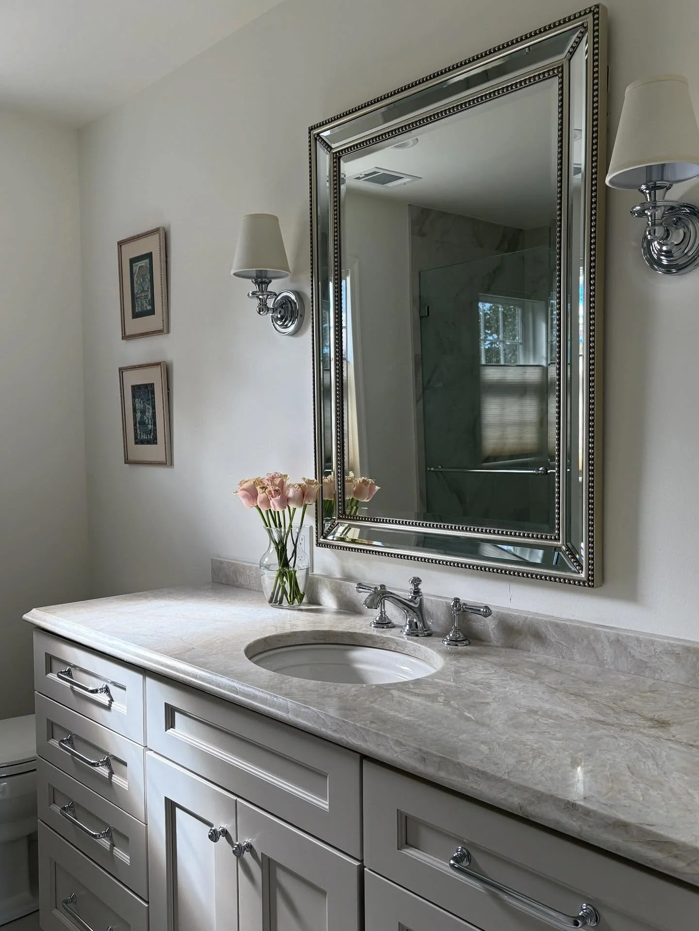 SQUEAKY CLEAN &bull; Transitional guest bathroom grounded in calming neutrals + punctuated with polished chrome hardware