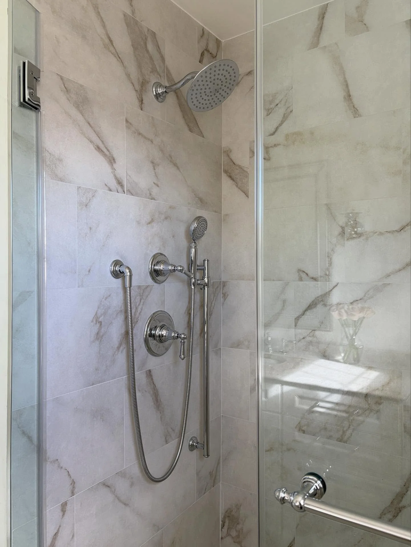 SQUEAKY CLEAN &bull; Transitional guest bathroom grounded in calming neutrals + punctuated with polished chrome hardware