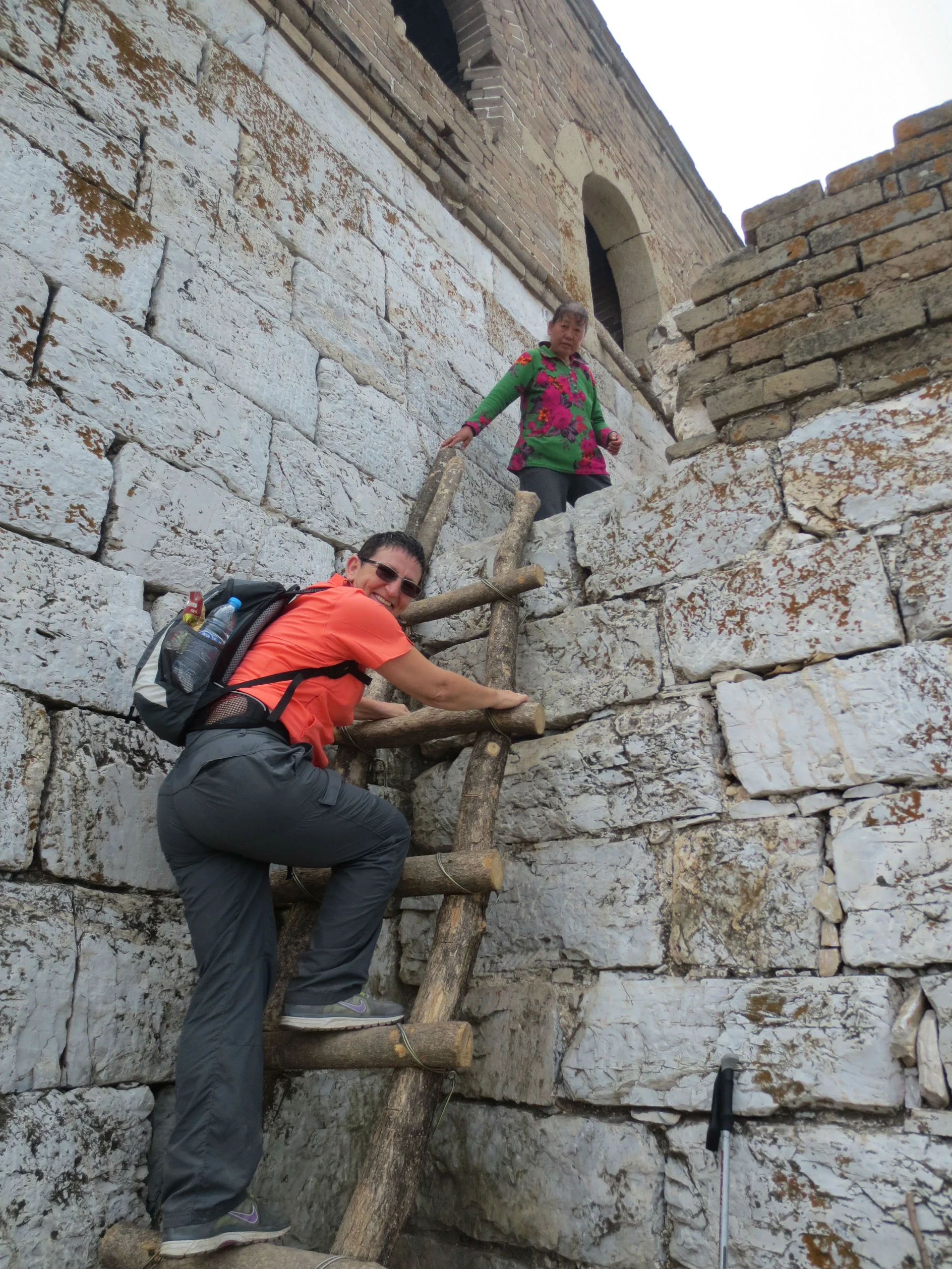 Climbing ladders into the old defence towers on the Great Wall