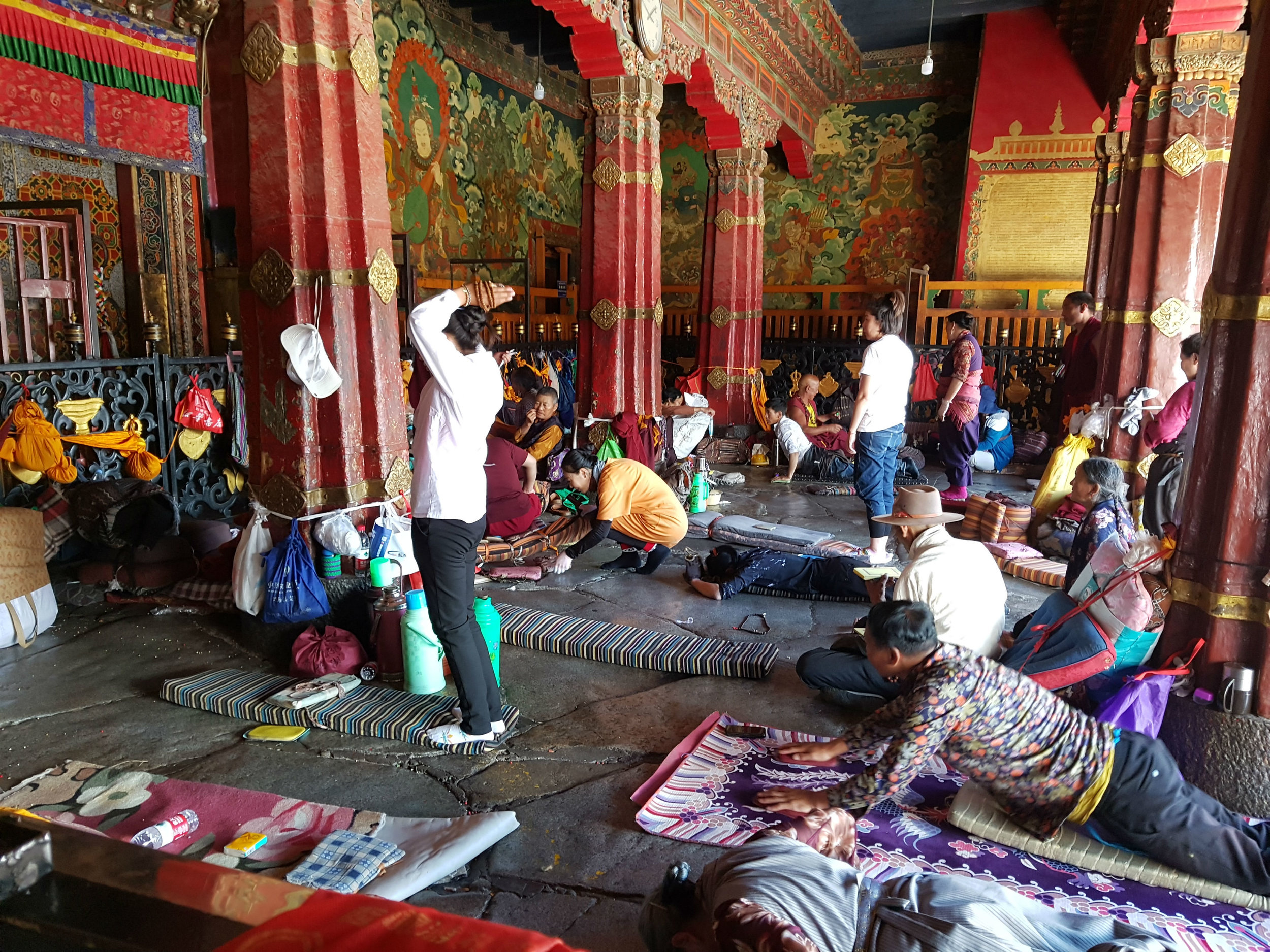 Devotees prostrating themselves in front of Jokhang Temple